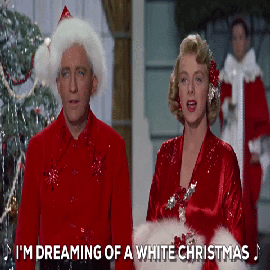 man and woman in red Christmas costumes singing