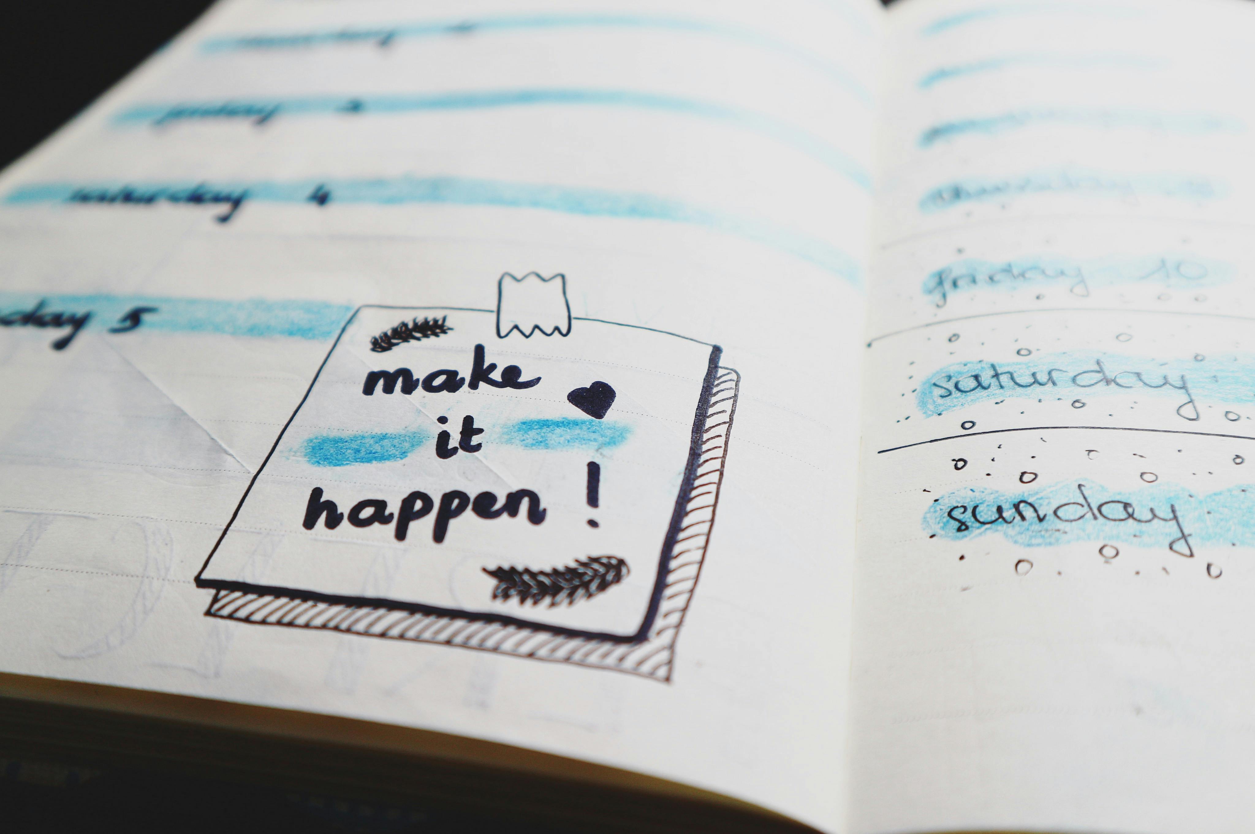 words saying \'make it happen\' on a white piece of paper