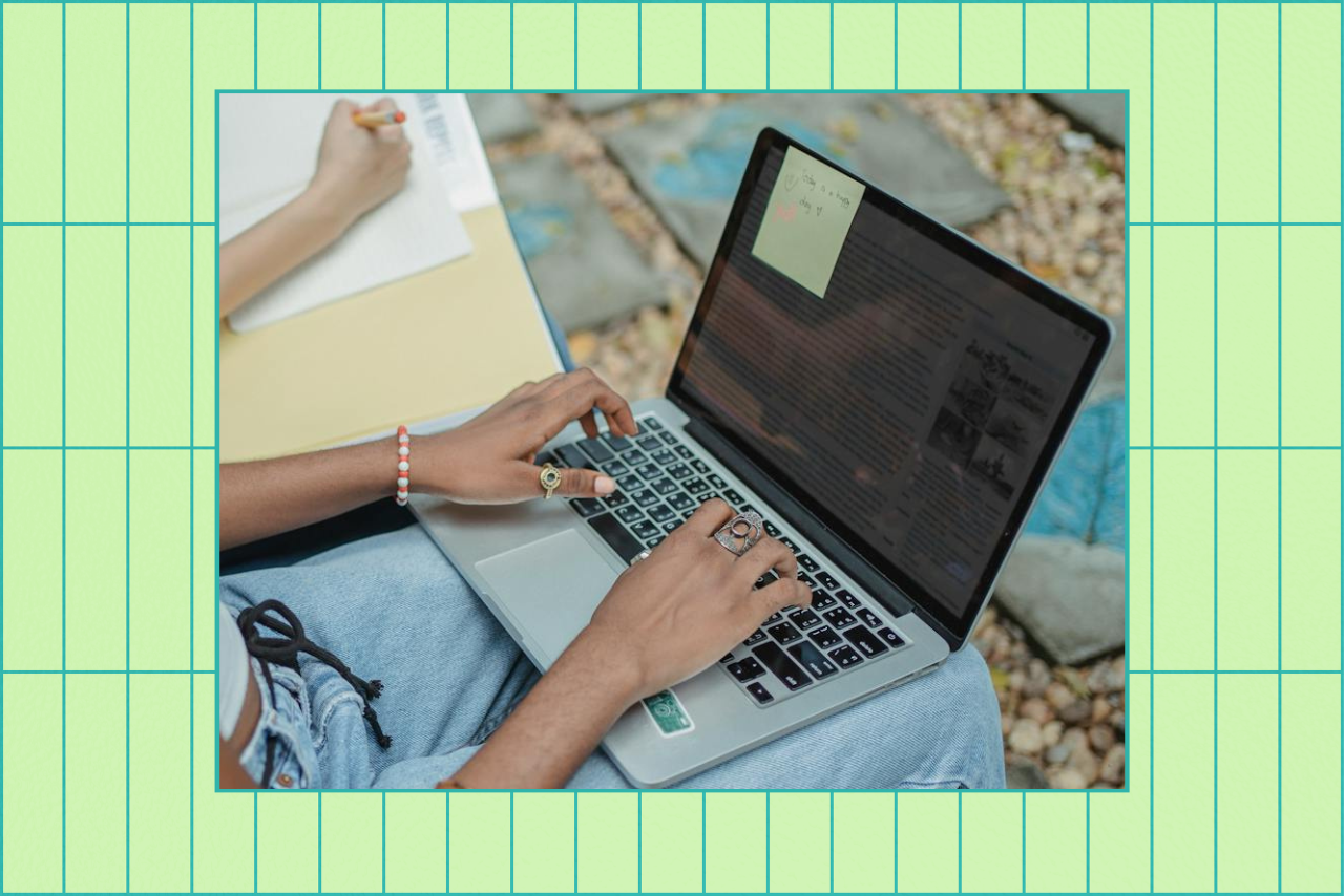 women studying and typing on laptop