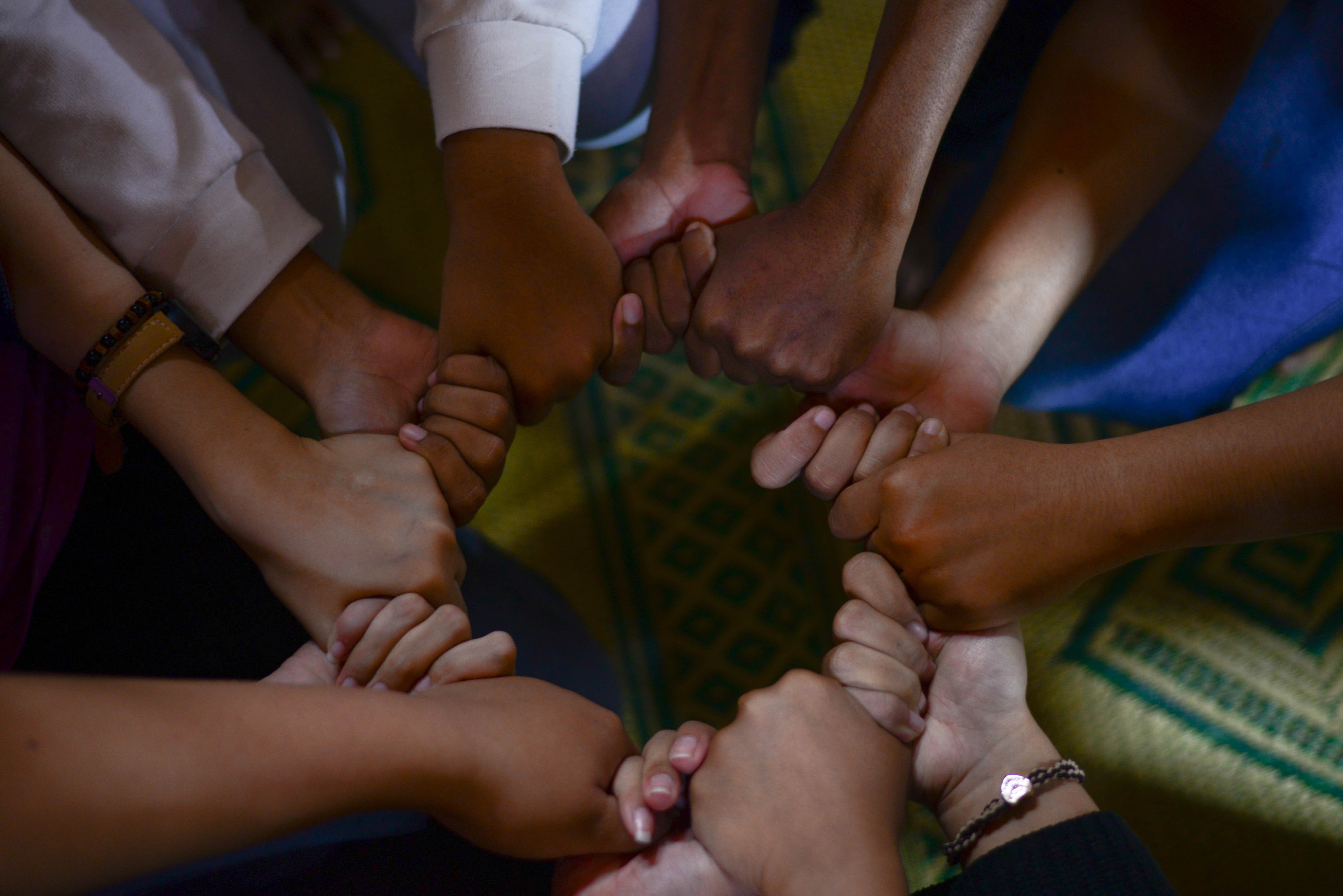 group of diverse people holding hands by Wylly Suhendra via Unsplash?width=698&height=466&fit=crop&auto=webp&dpr=4