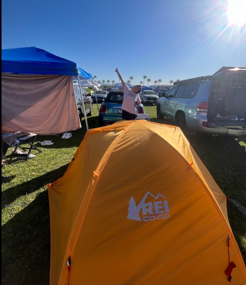 A tent, a car, and a girl