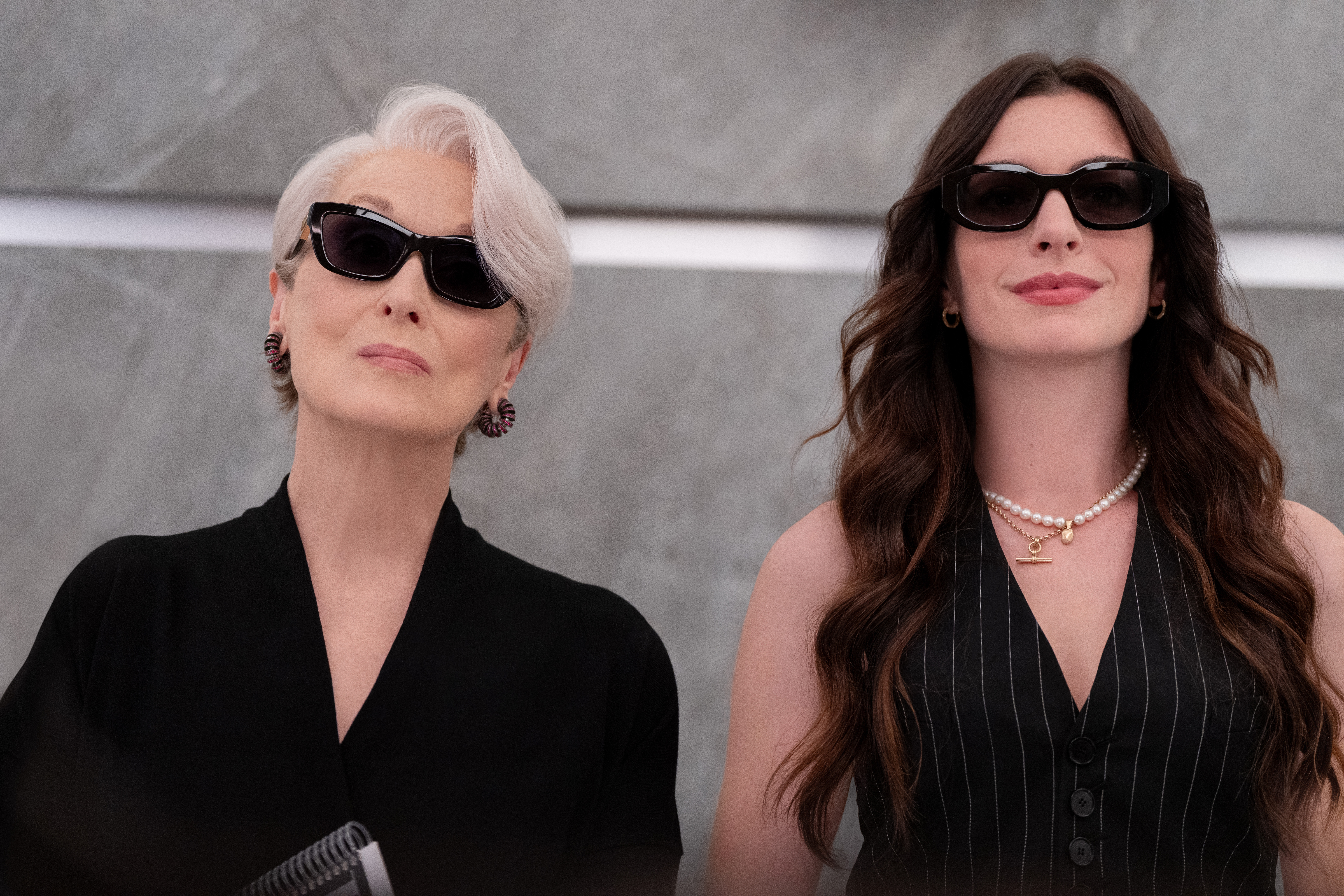 anne hathaway and meryl streep wearing sunglasses in devil wears prada 2