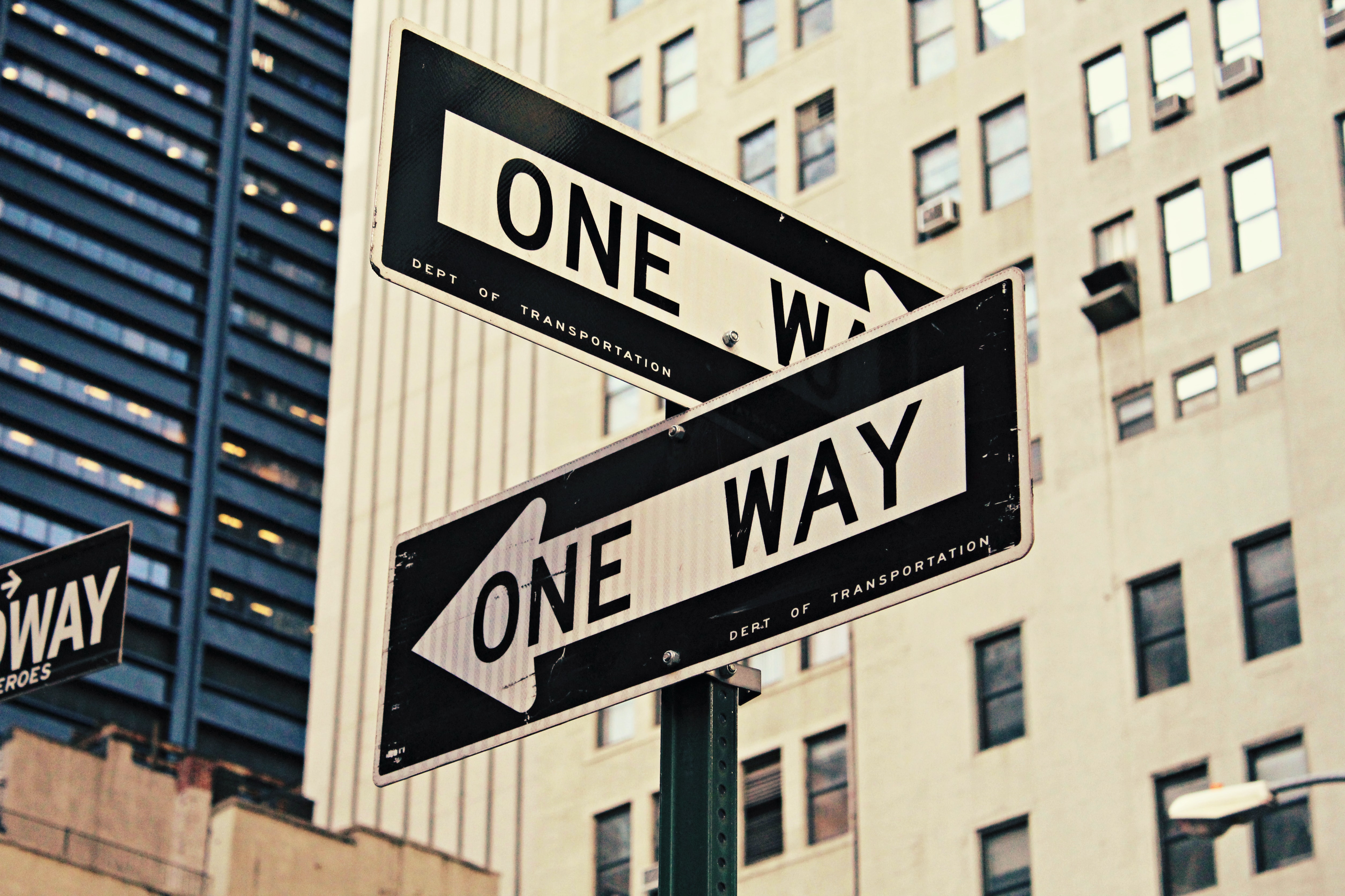 one way street sign by Brendan Church on Unsplash
