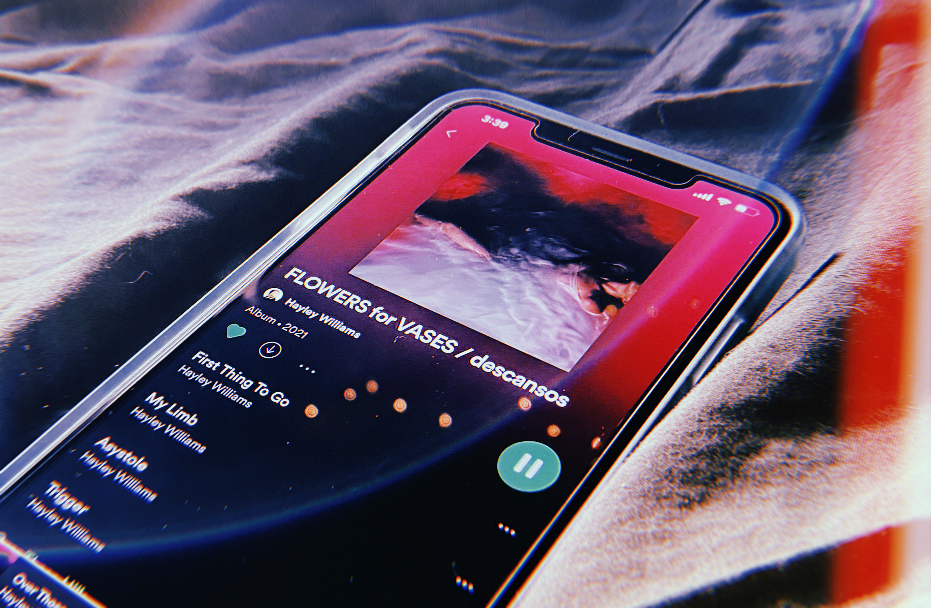 Flowers For Vases / descansos by Hayley Williams playing on a phone