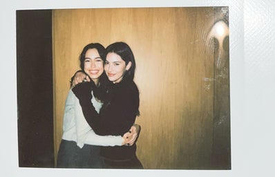 Polaroid picture of Gracie Abrams and a fan hugging