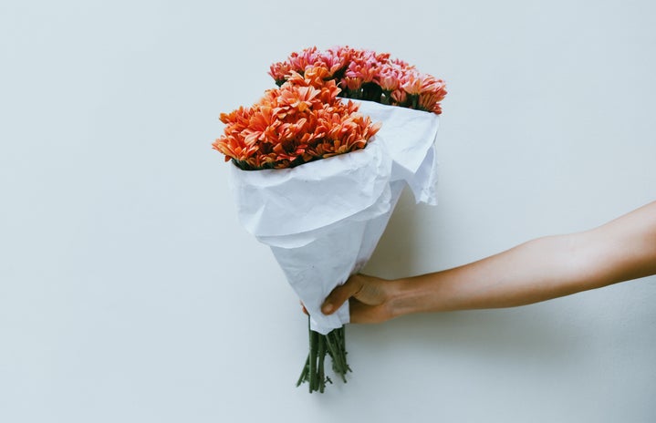 someone holding flowers