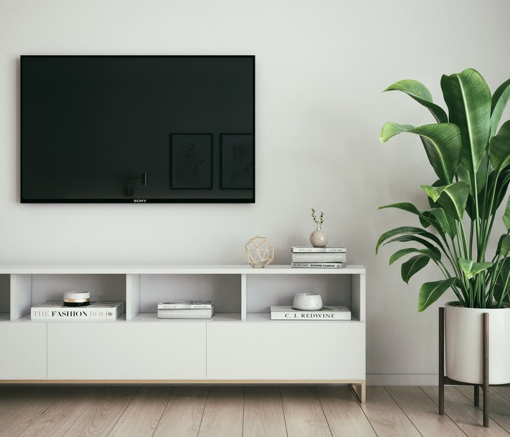 black tv with white bookshelf