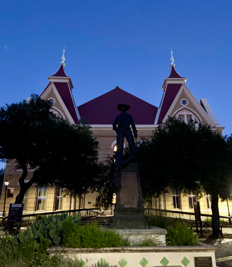 The Vaquero in front of Old Main at Texas State University.