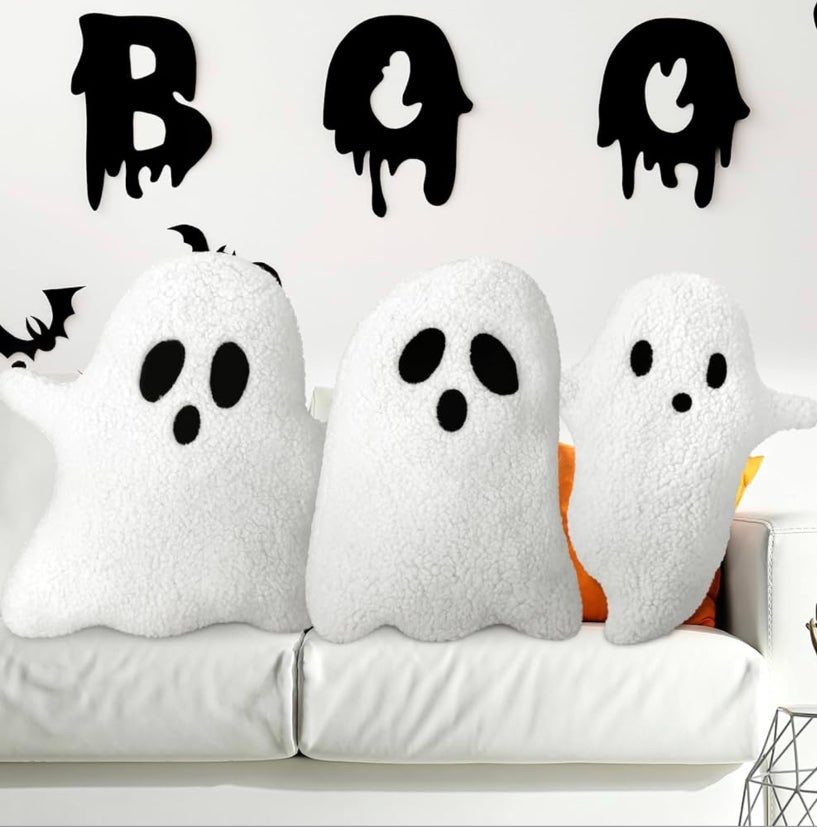 Three throw pillows in the shape of ghosts