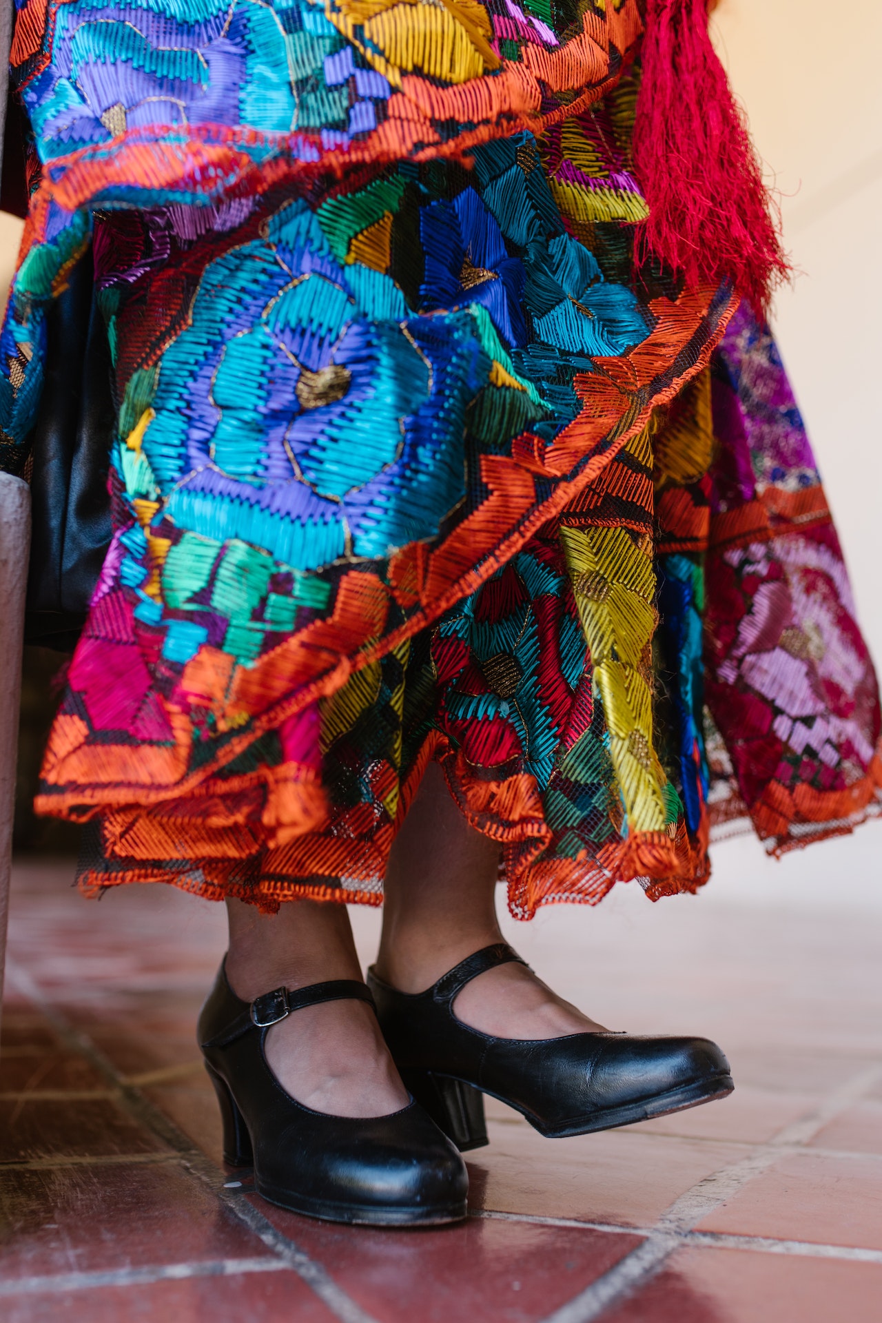 woman in traditional mexican dress and dancing shoes