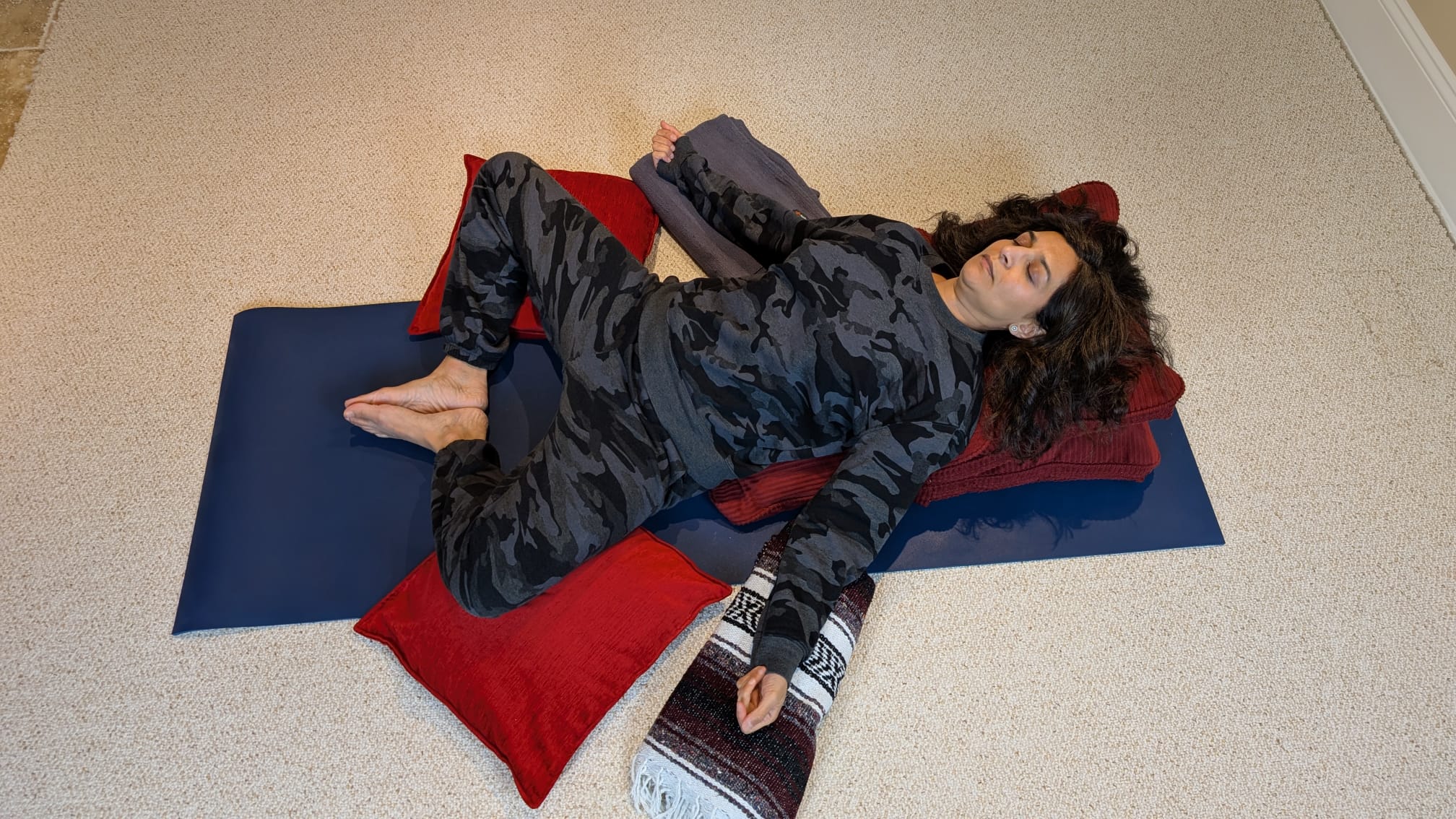 Woman in reclining bound angle