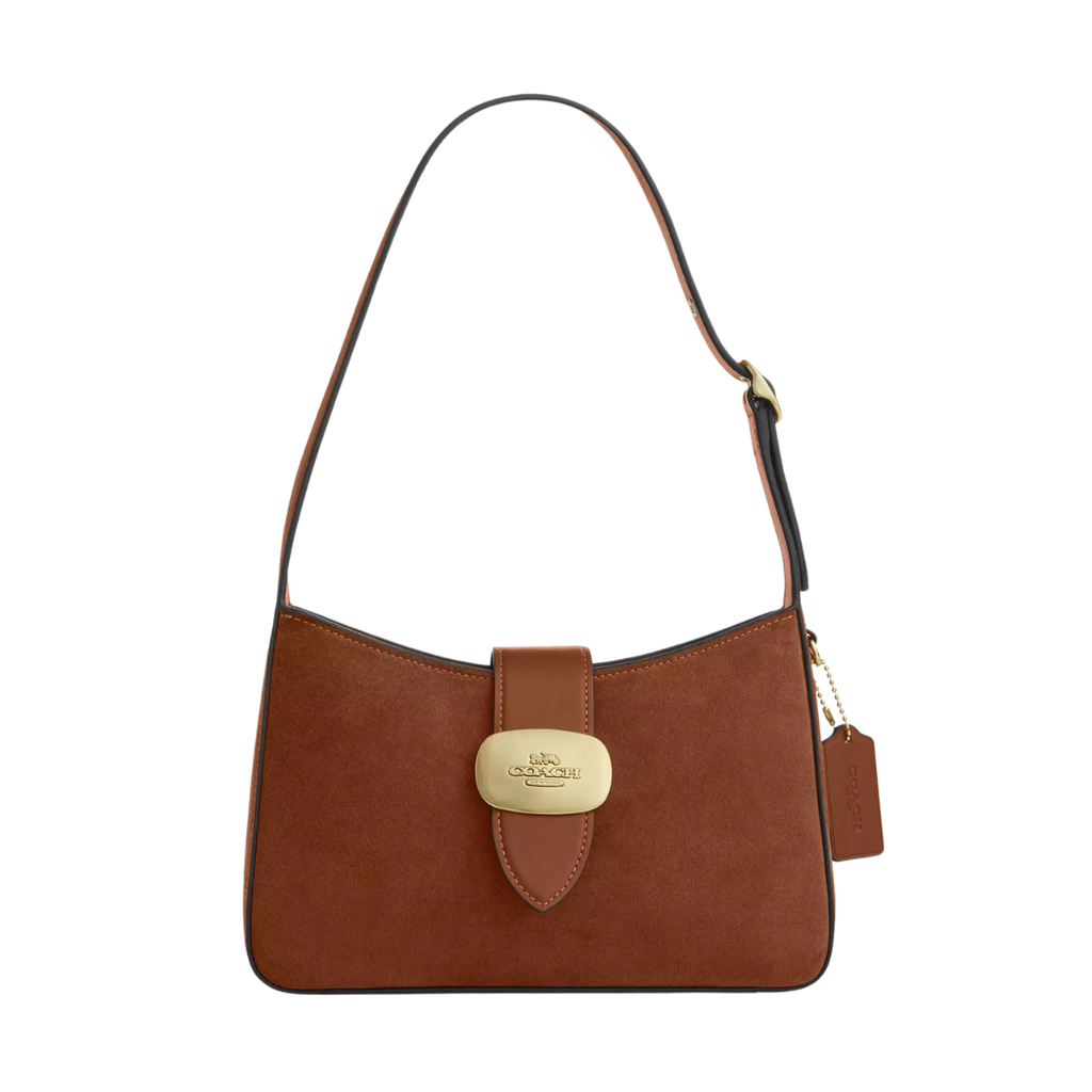 a brown suede shoulder bag with gold buckle