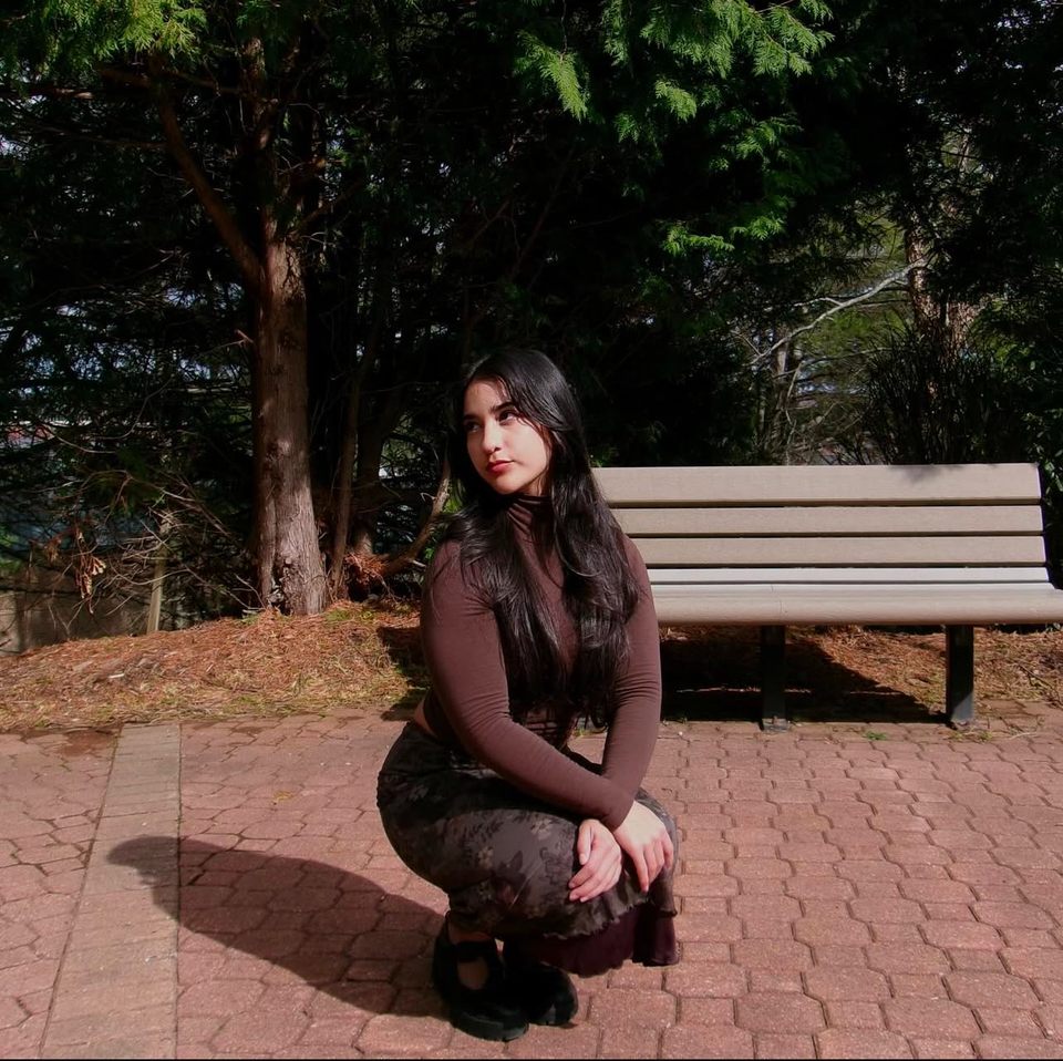 A girl posing, squating