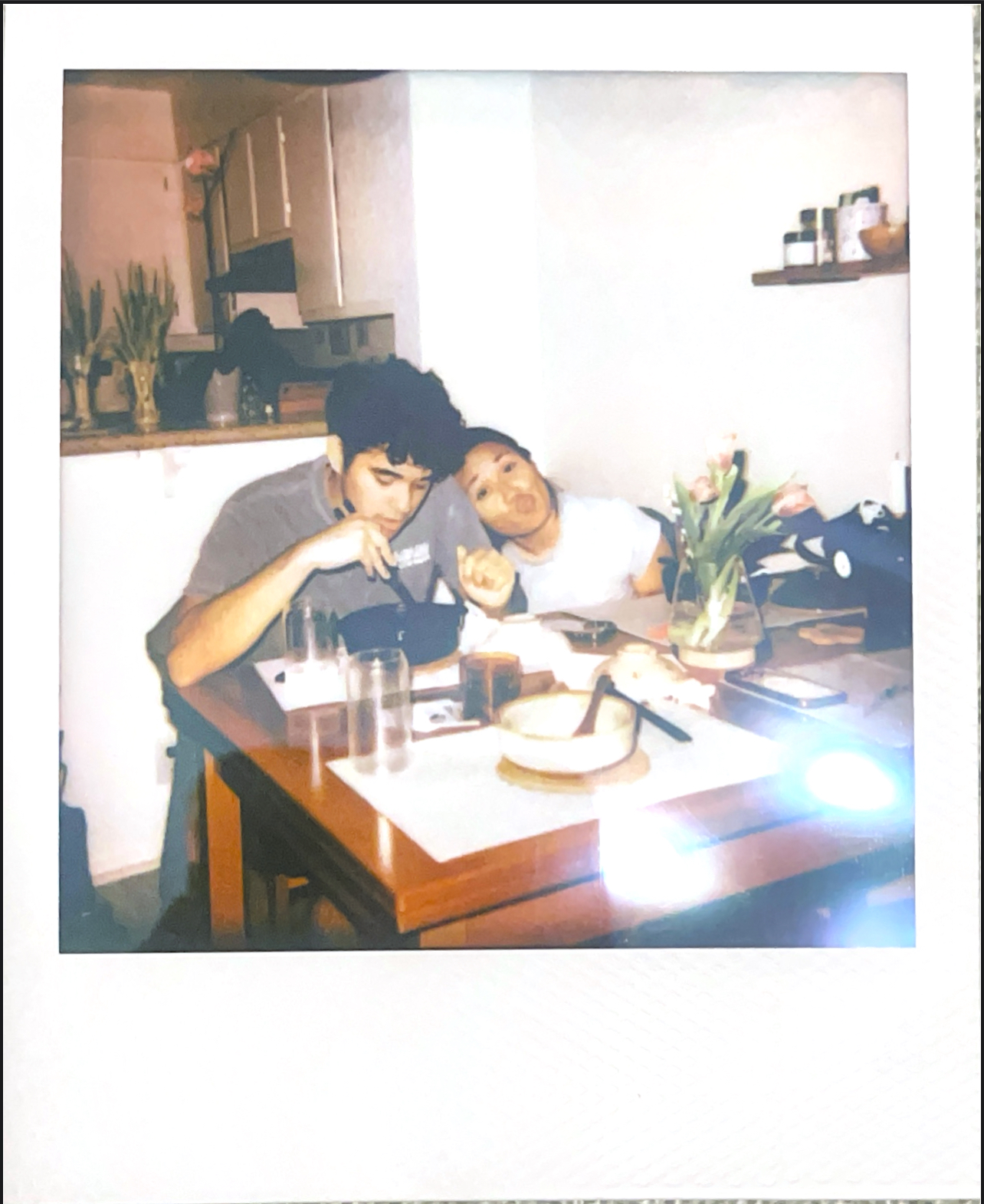 Women and man at a dinner table