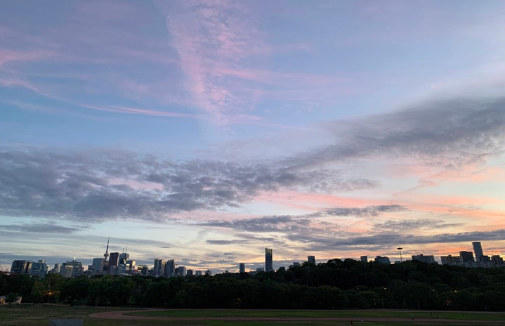 The Toronto skyline view from Riverdale Park at sunset.