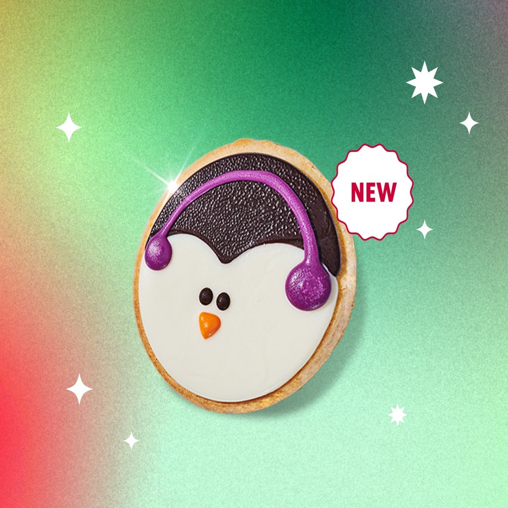 starbucks product shot of penguin cookie on multicoloured background