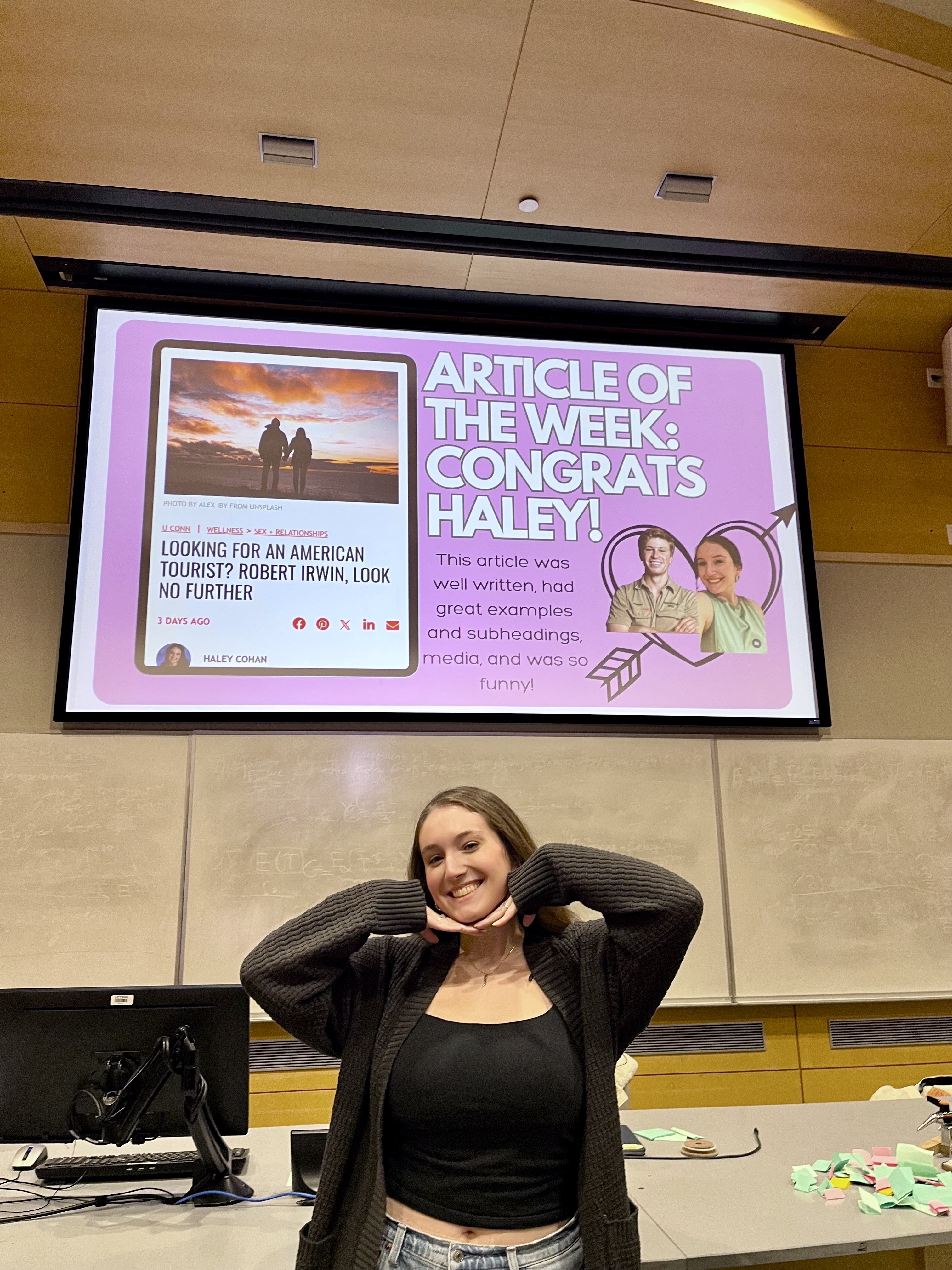 Image of the author with a slide of her featured article