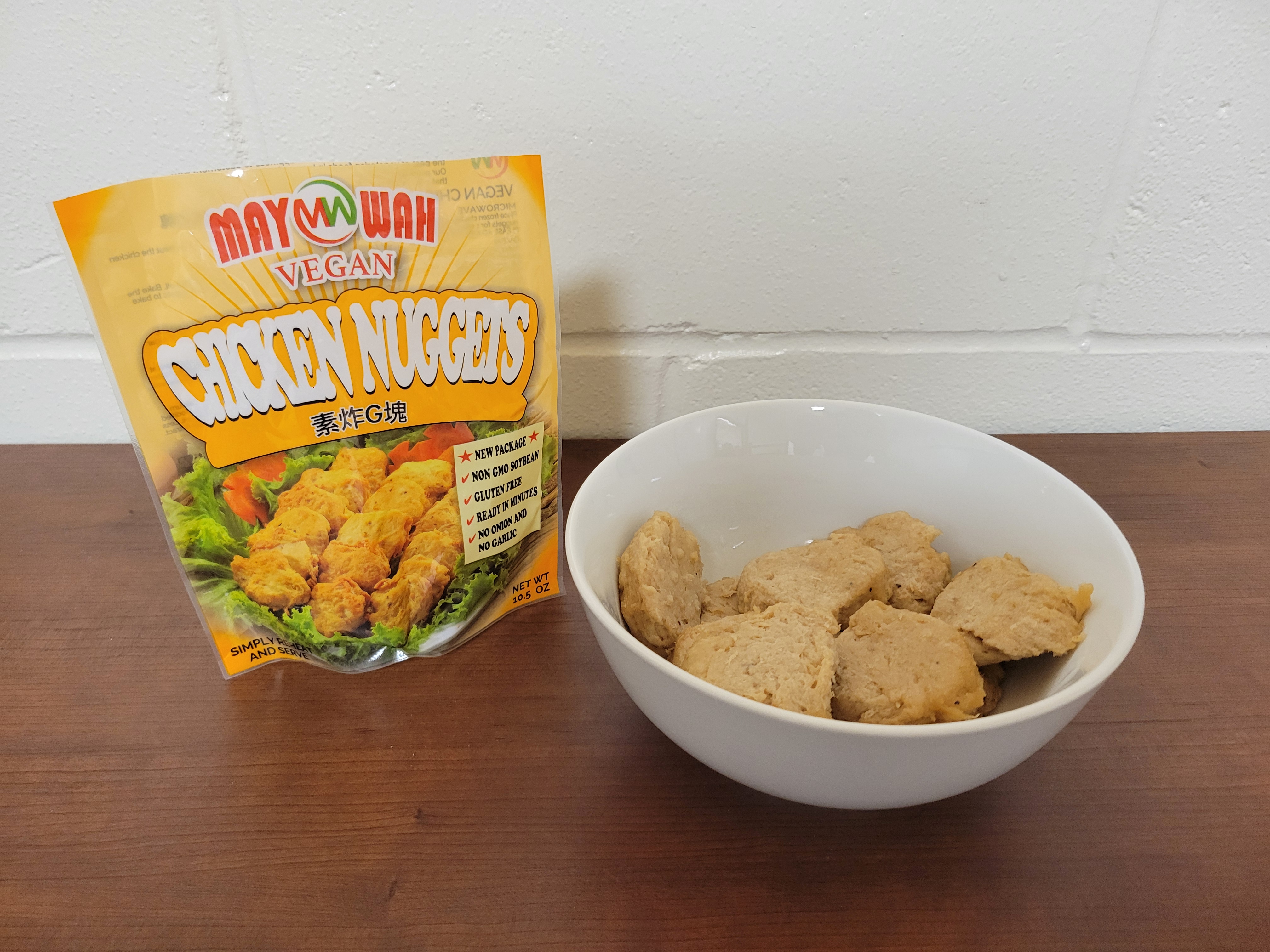 Vegan meat in a bowl with the bag next to it