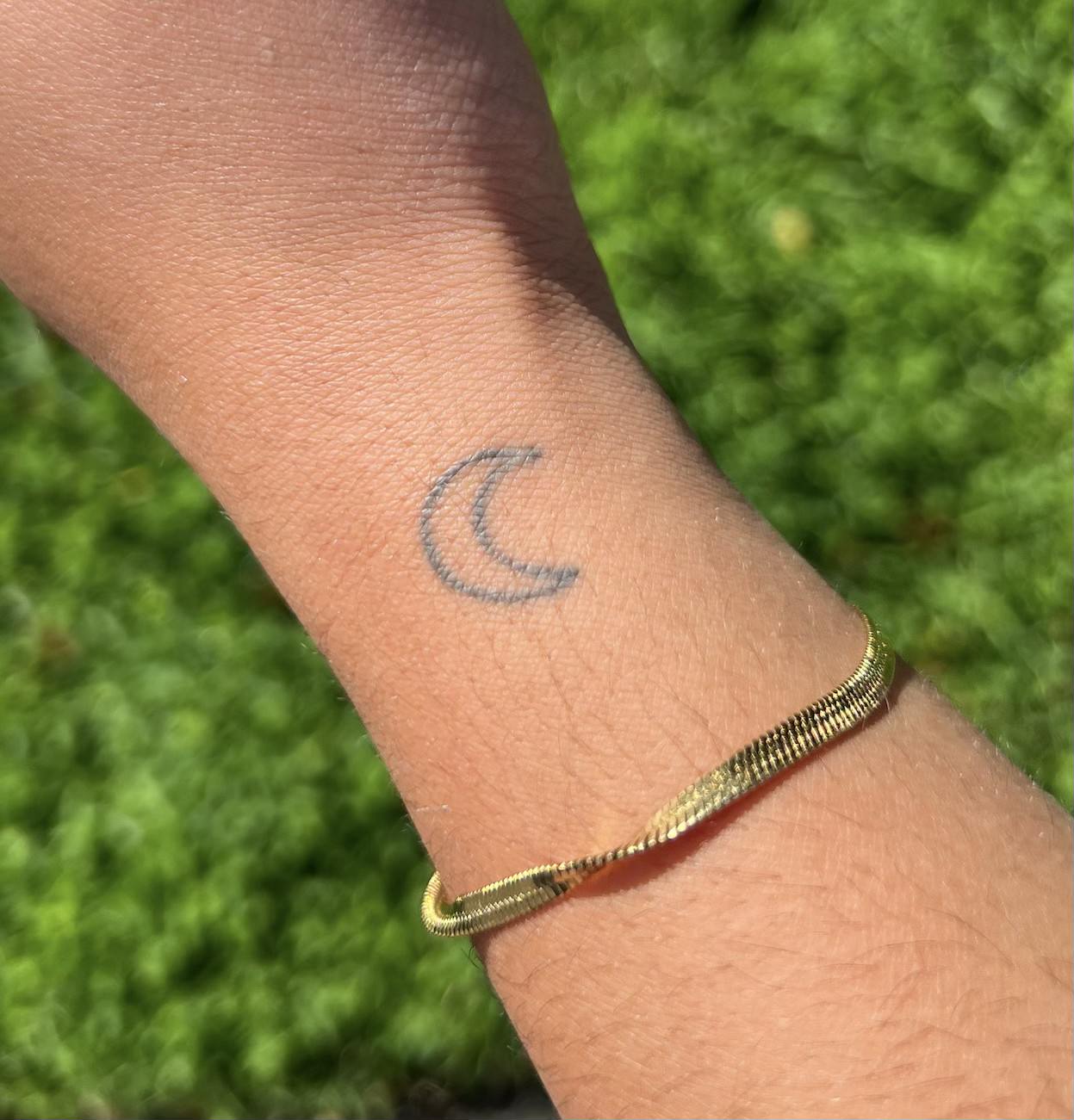 tattoo of moon on arm