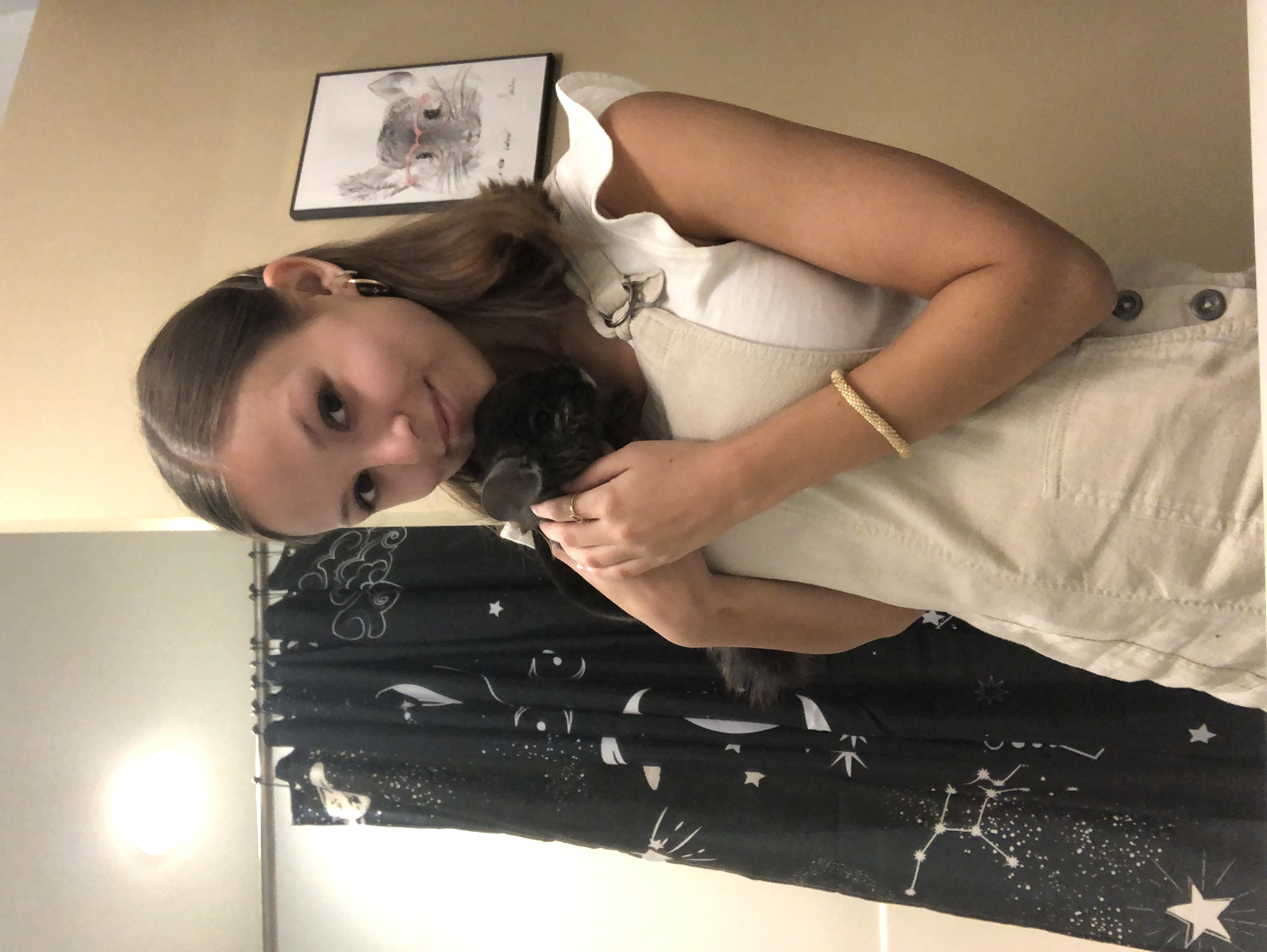 girl and her pet chinchilla