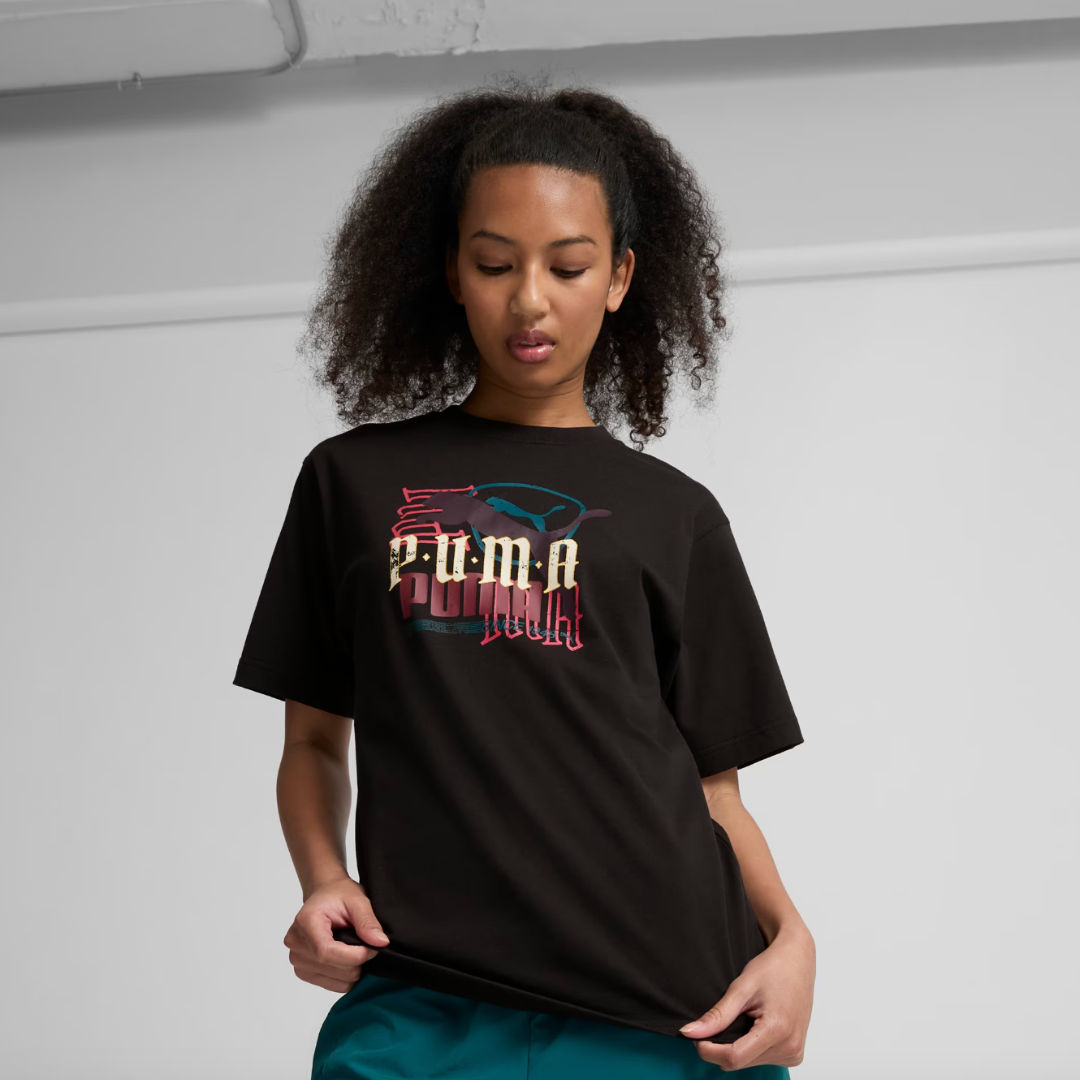 woman wearing a black graphic tee with the PUMA logo on it