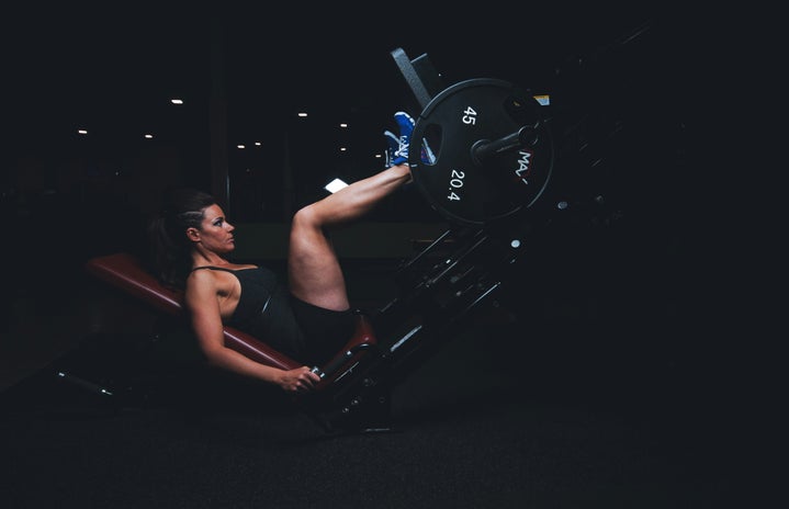 Woman doing leg press machine