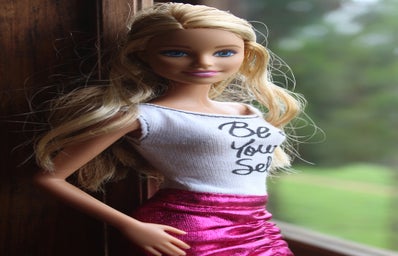 Barbie Doll in Window