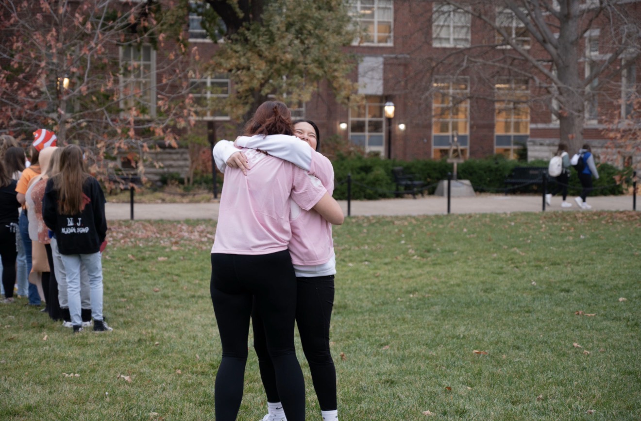 two college girls hugging