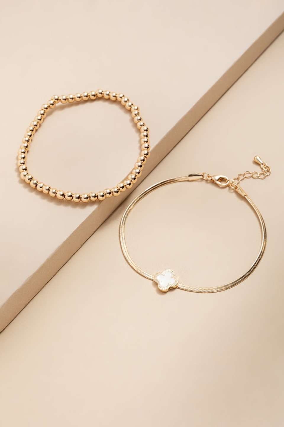 Francesca’s Judith Clover Charm and Gold Bead Bracelet Set