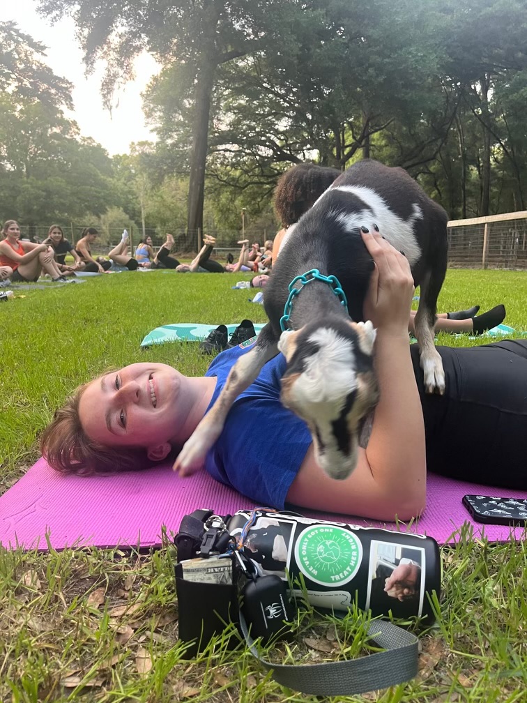Girl doing goat yoga