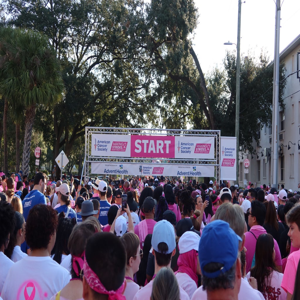 Crowd of people at breast cancer walk start line