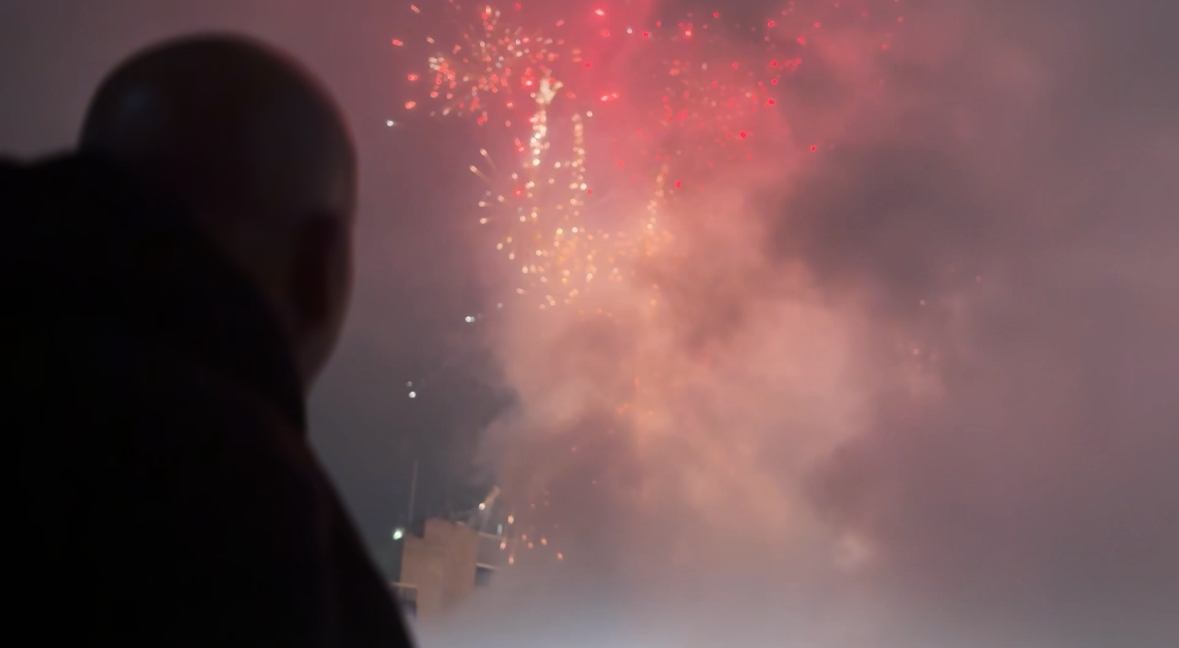 Shadow of a man watching fireworks at AC/DC concert