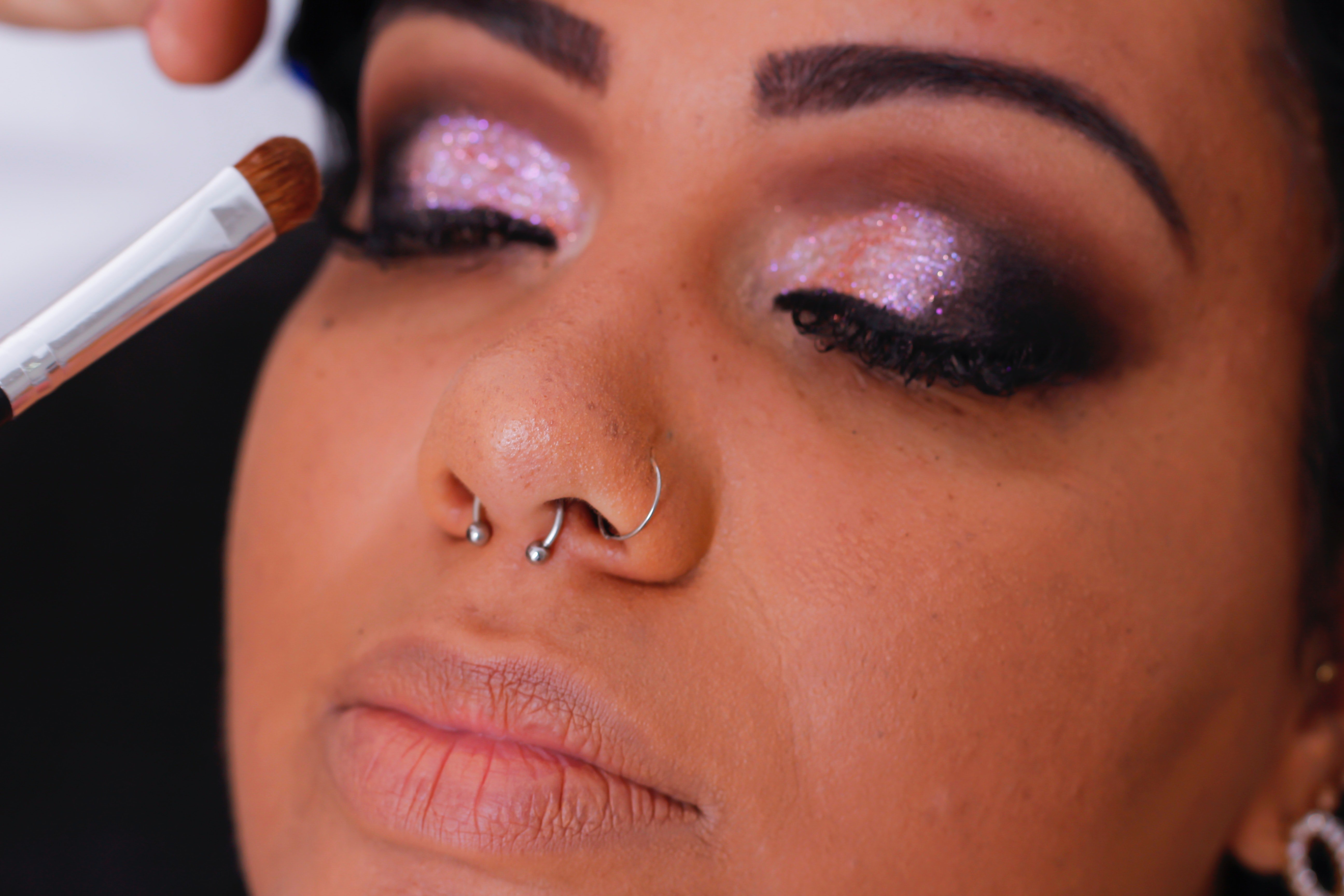 woman pink glittery eyeshadow dark eyeliner?width=1024&height=1024&fit=cover&auto=webp&dpr=4