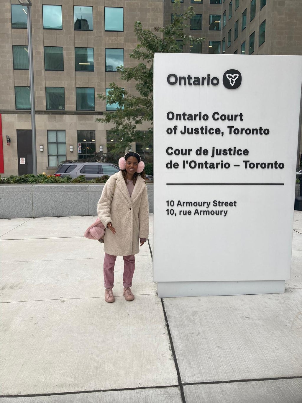 Girl in front of Ontario Court of Justice