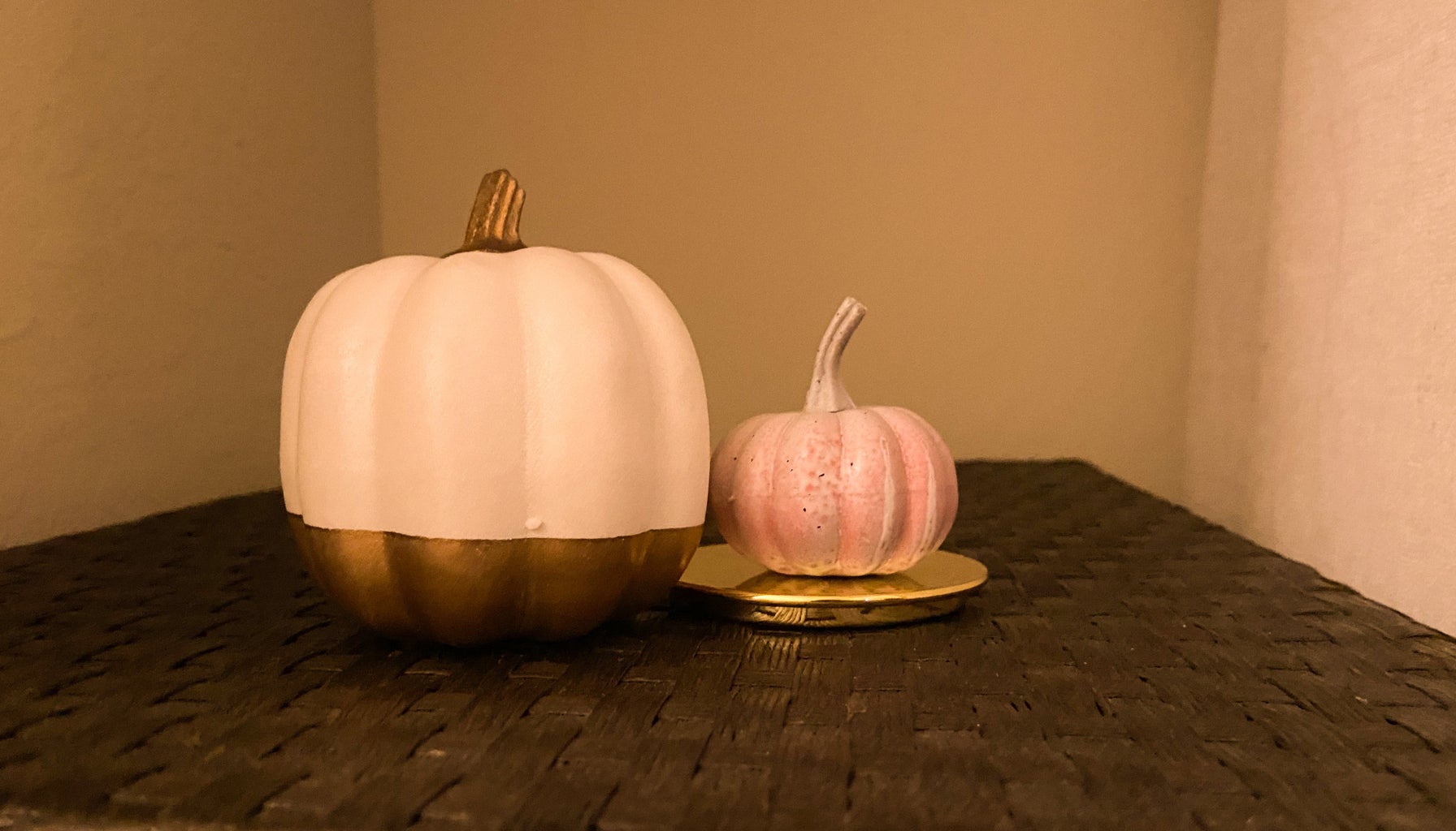 2 different sized painted pumpkins