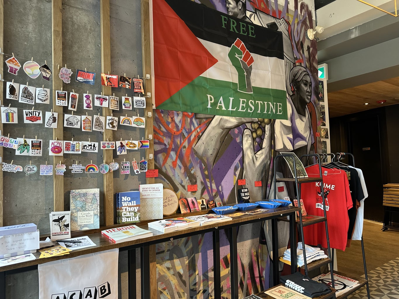 Stickers, posters and books being showcased at a café