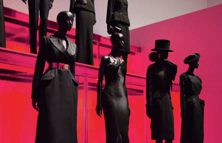 black mannequins with red background