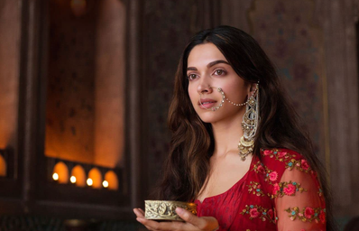 The image is of an Indian actress, Deepika Padukone, in a Bollywood movie wearing traditional indian clothes and jewelery.