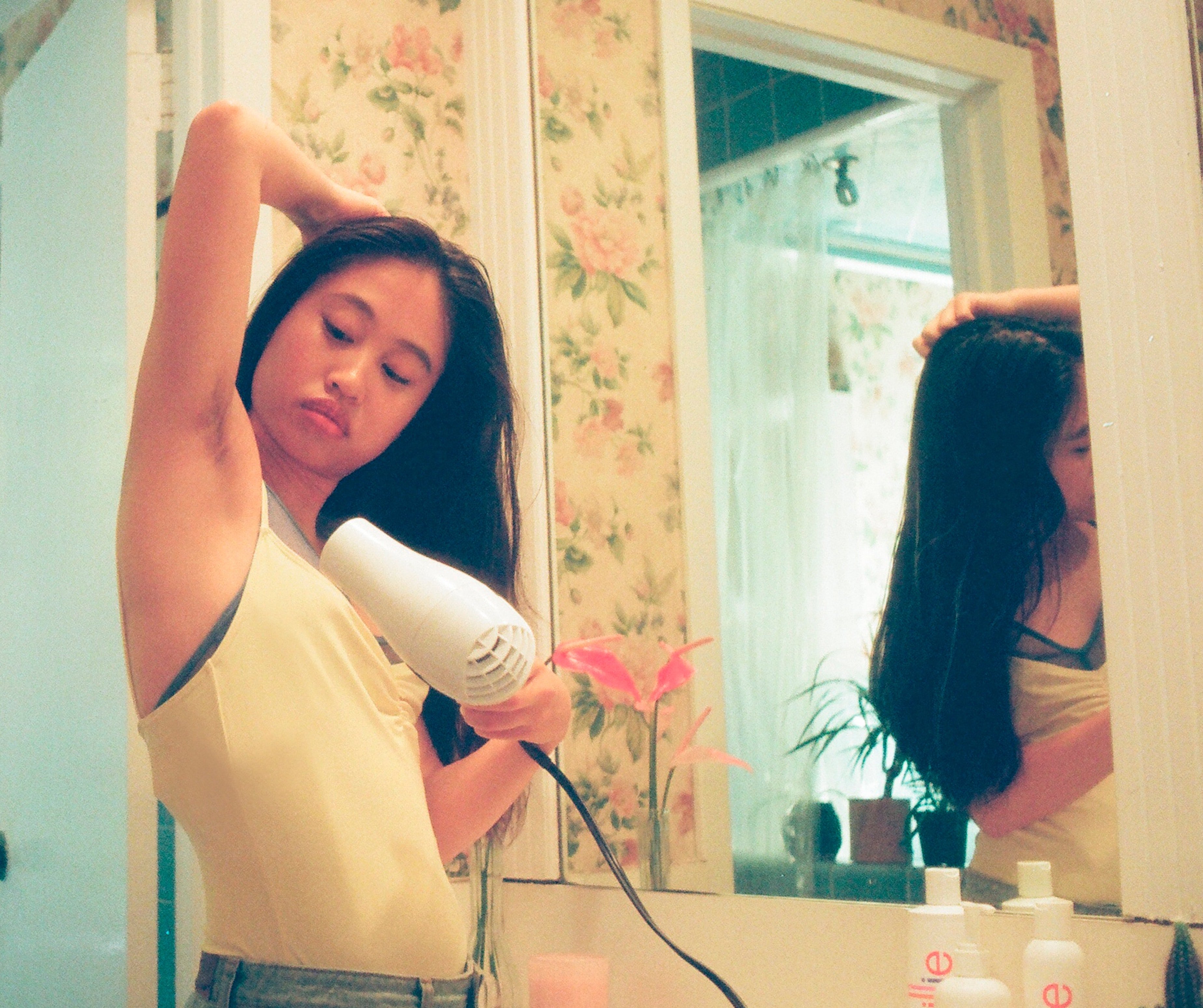 drying off underarm sweat with hairdryer by Billie on Unsplash