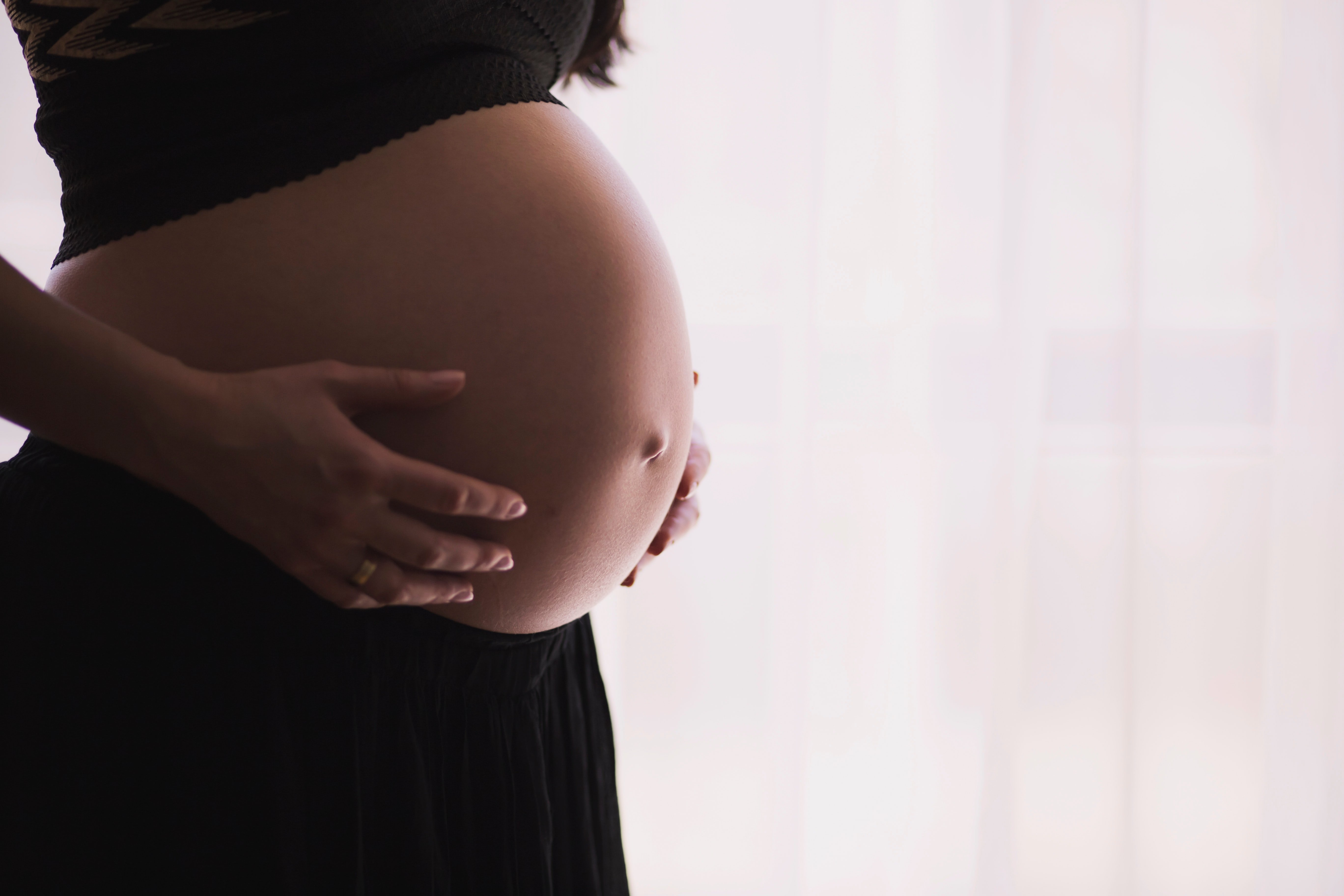 pregnant woman by freestocks from Unsplash?width=698&height=466&fit=crop&auto=webp&dpr=4