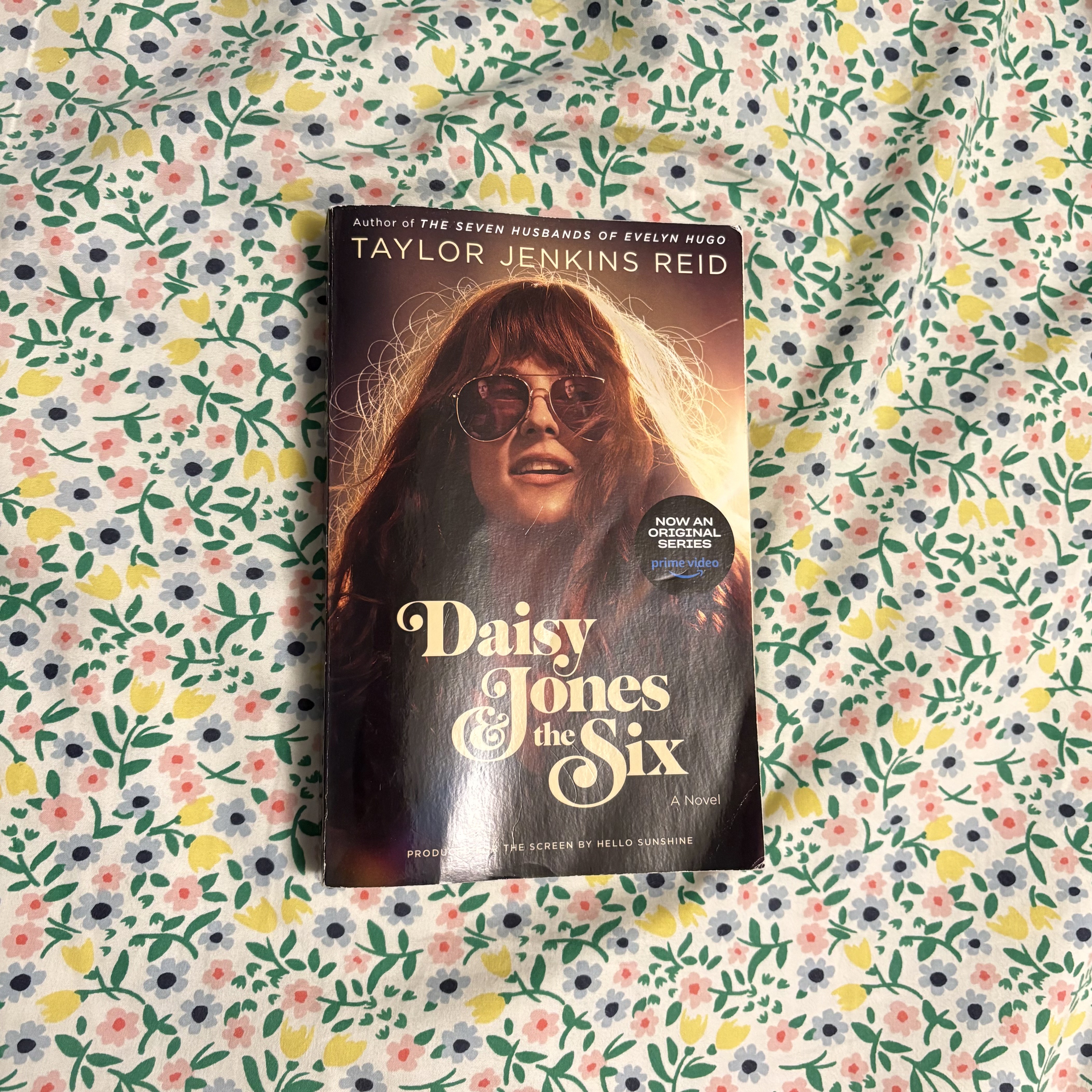 book cover of \'daisy jones and the six\' on bedsheet