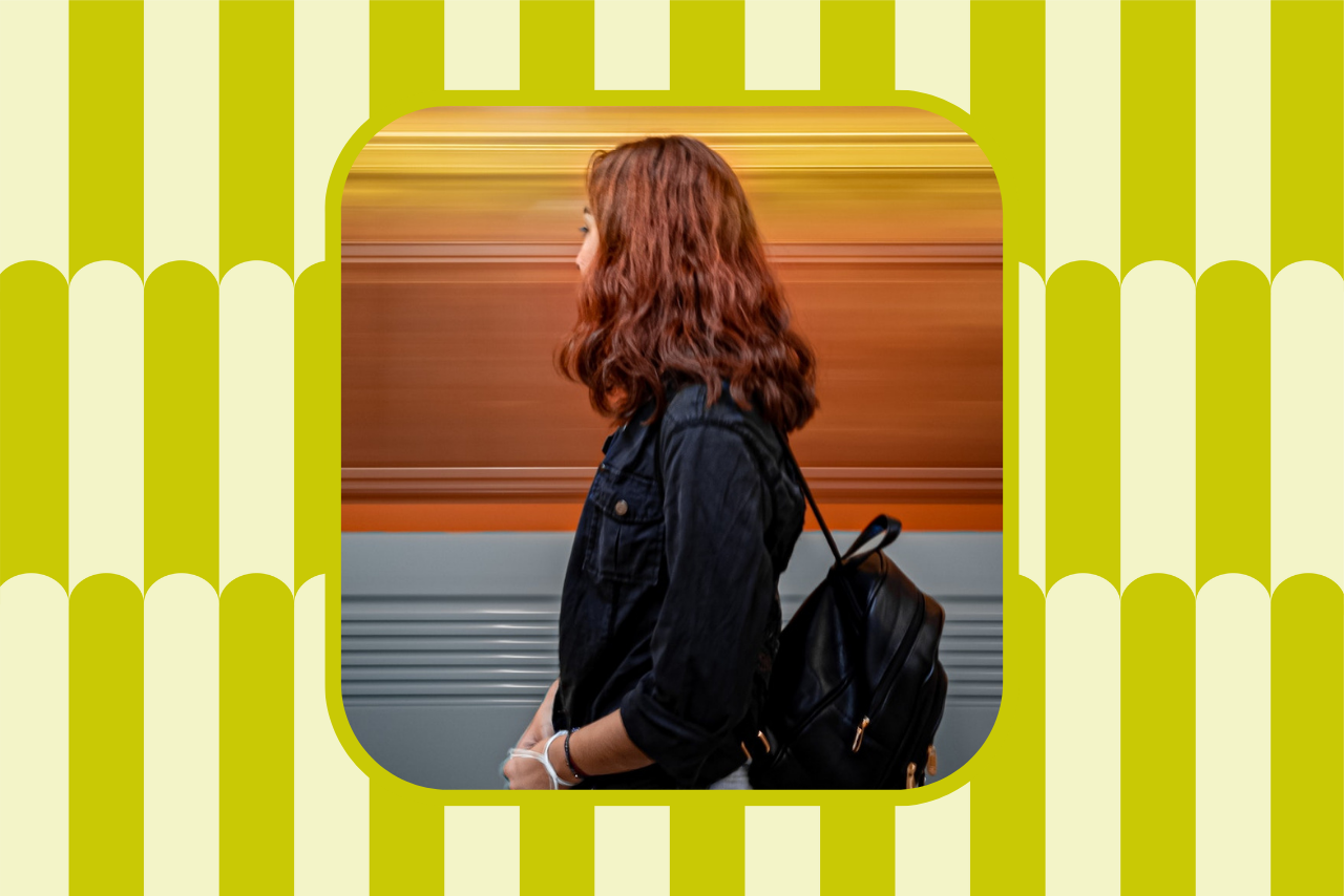 woman facing away with backpack