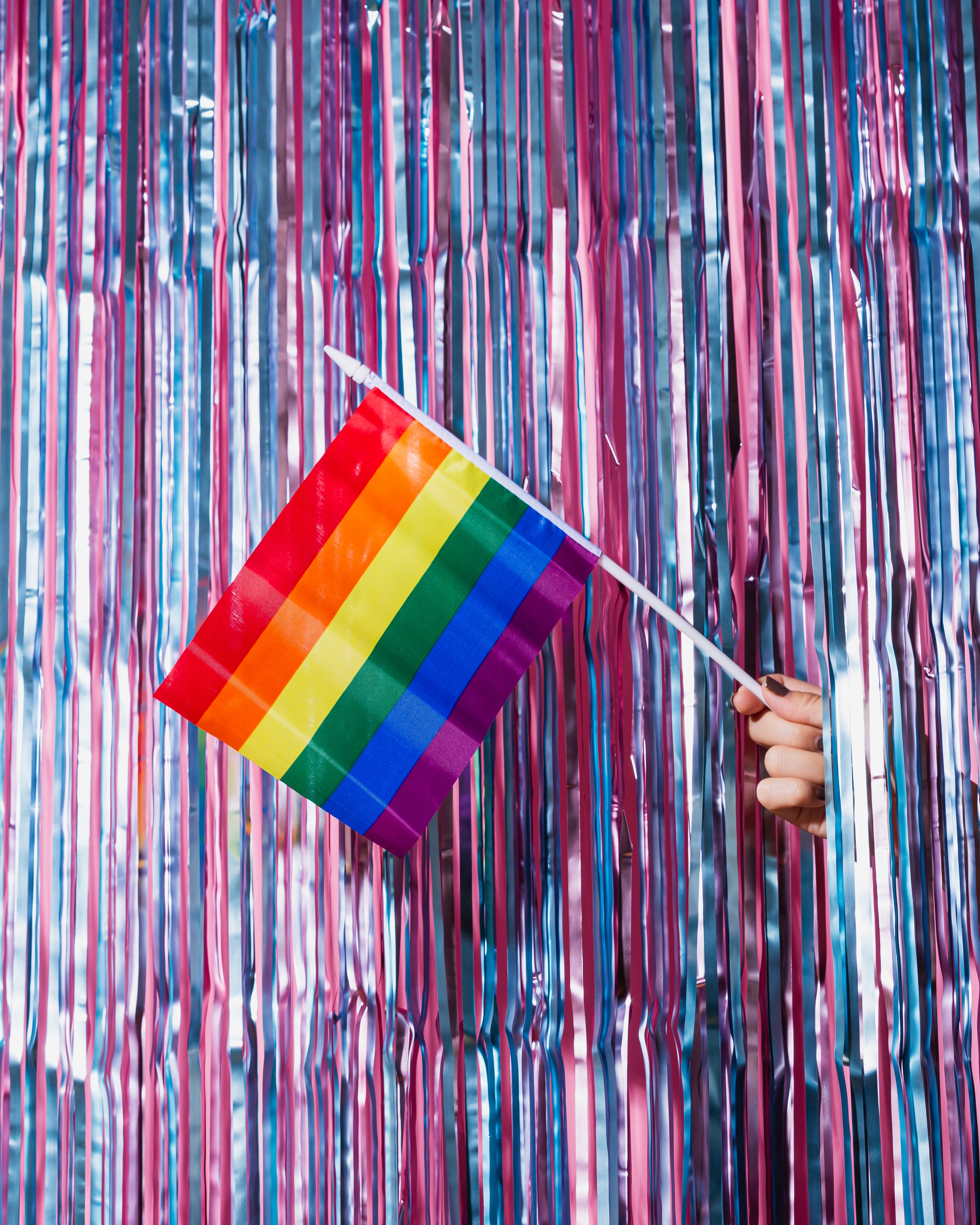 pride flag with streamers by Unsplash