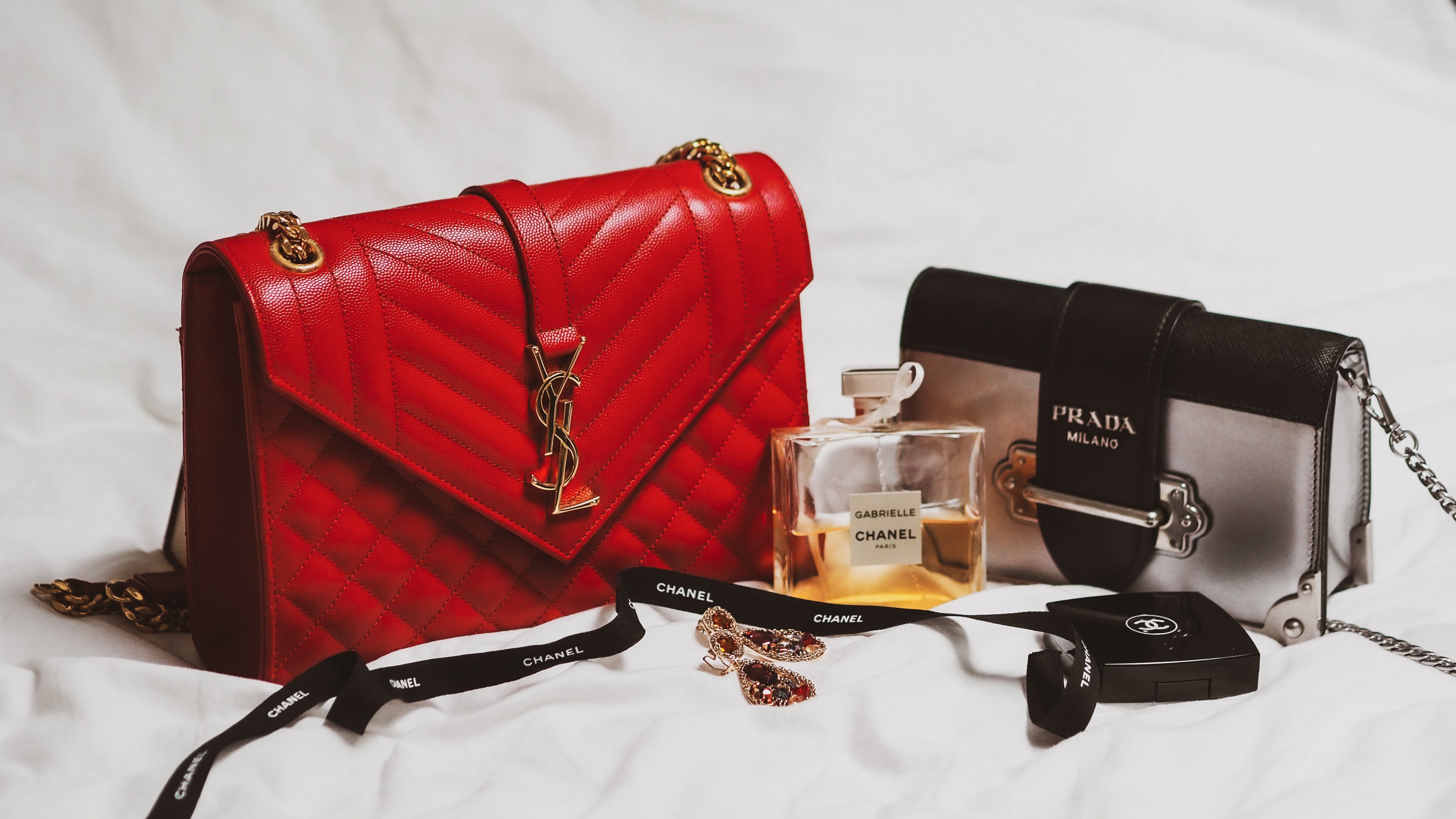 YSL and Prada purse with Chanel perfume by Laura Chouette?width=698&height=466&fit=crop&auto=webp&dpr=4