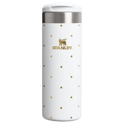 16 oz aero stanley with a white base that is dotted in gold which resemble Christmas lights