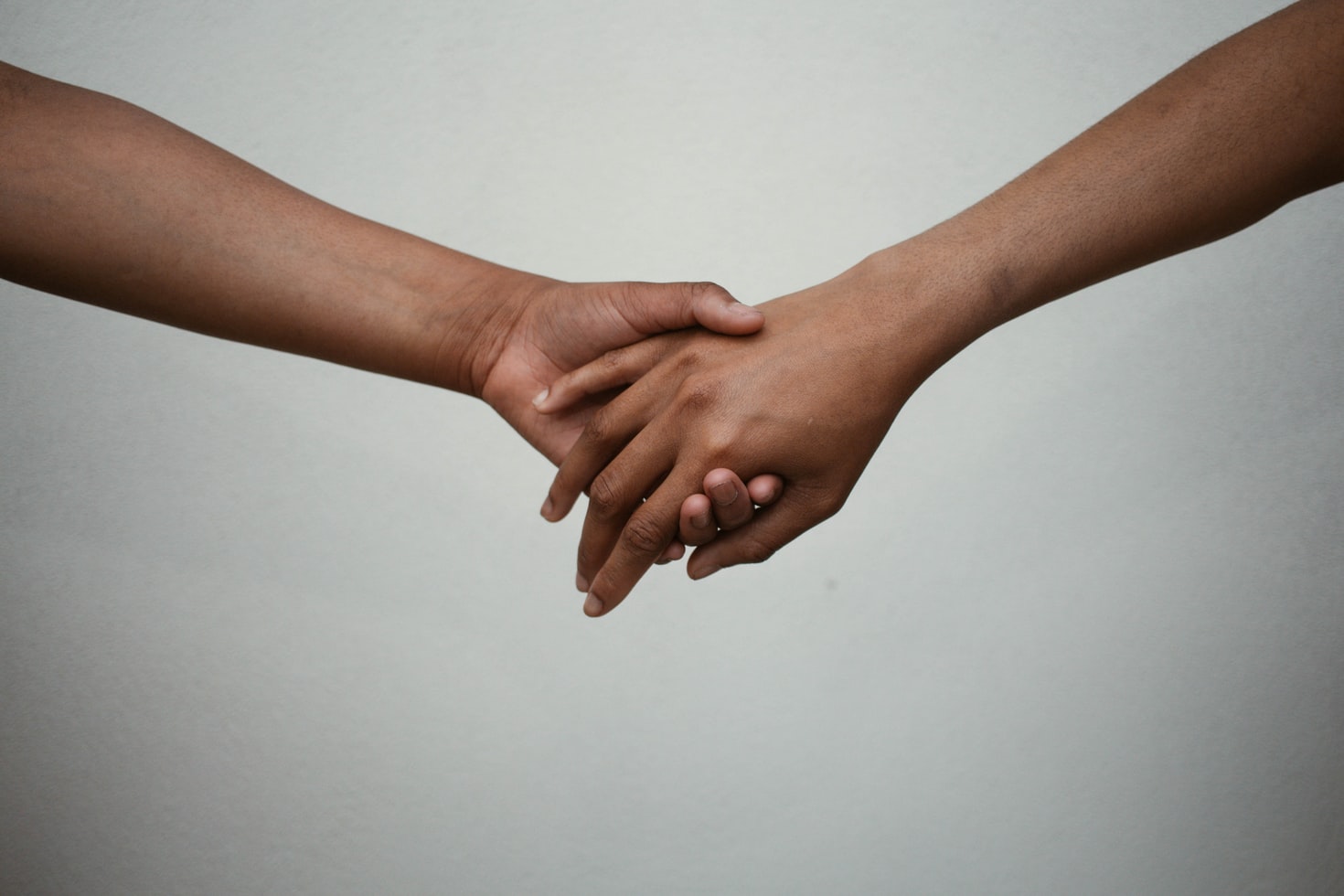Two people holding hands.