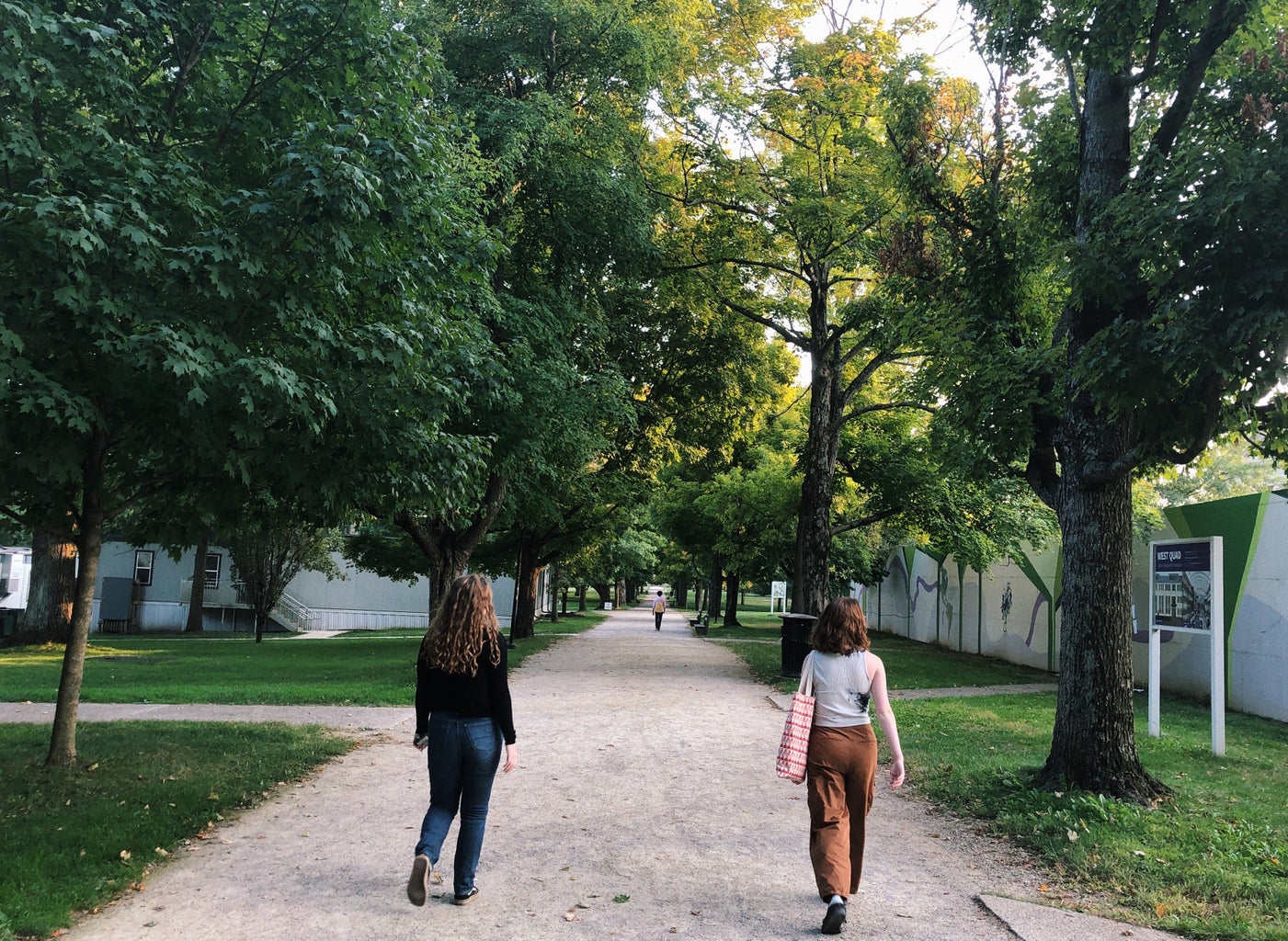 girls walking down a path