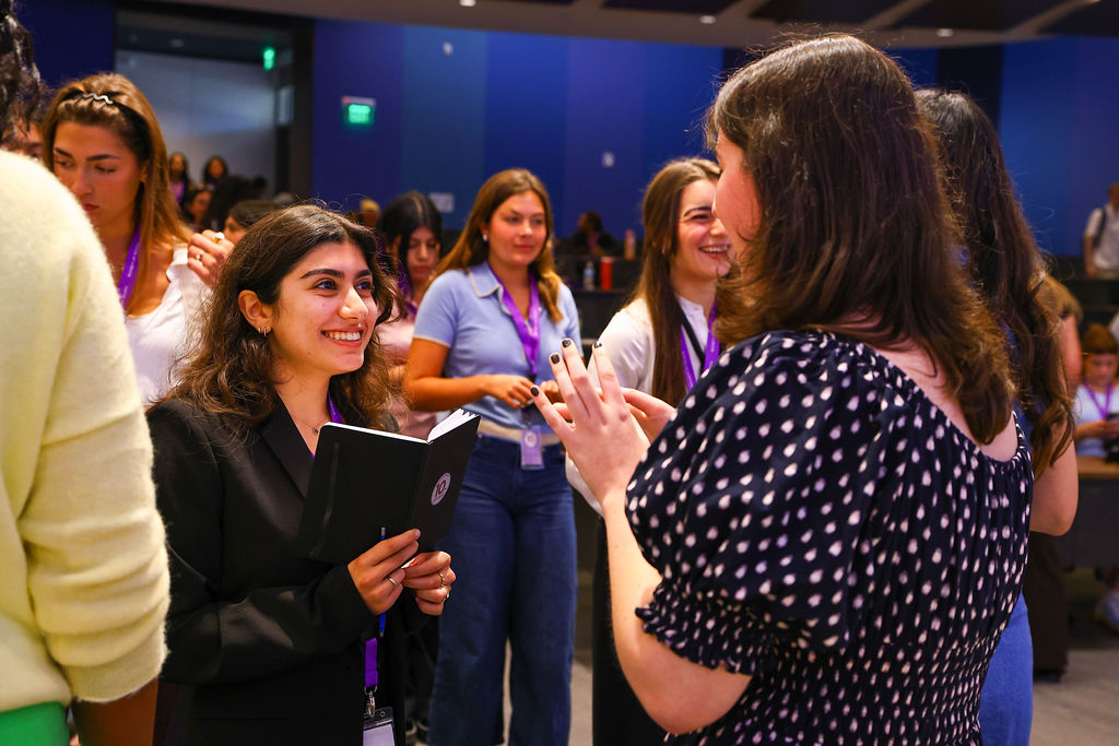 student talking to woman