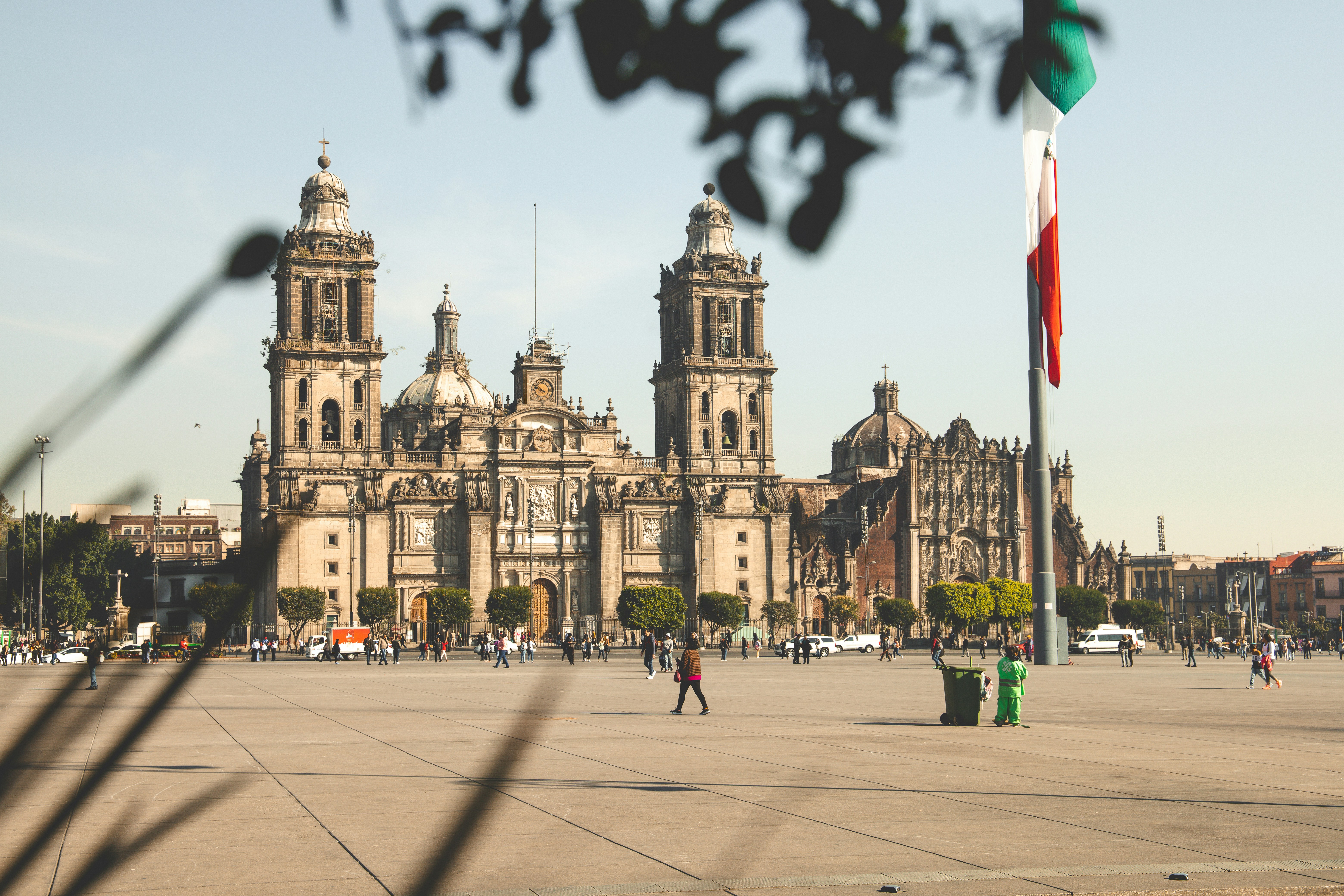 People walking by a building in Mexico City.