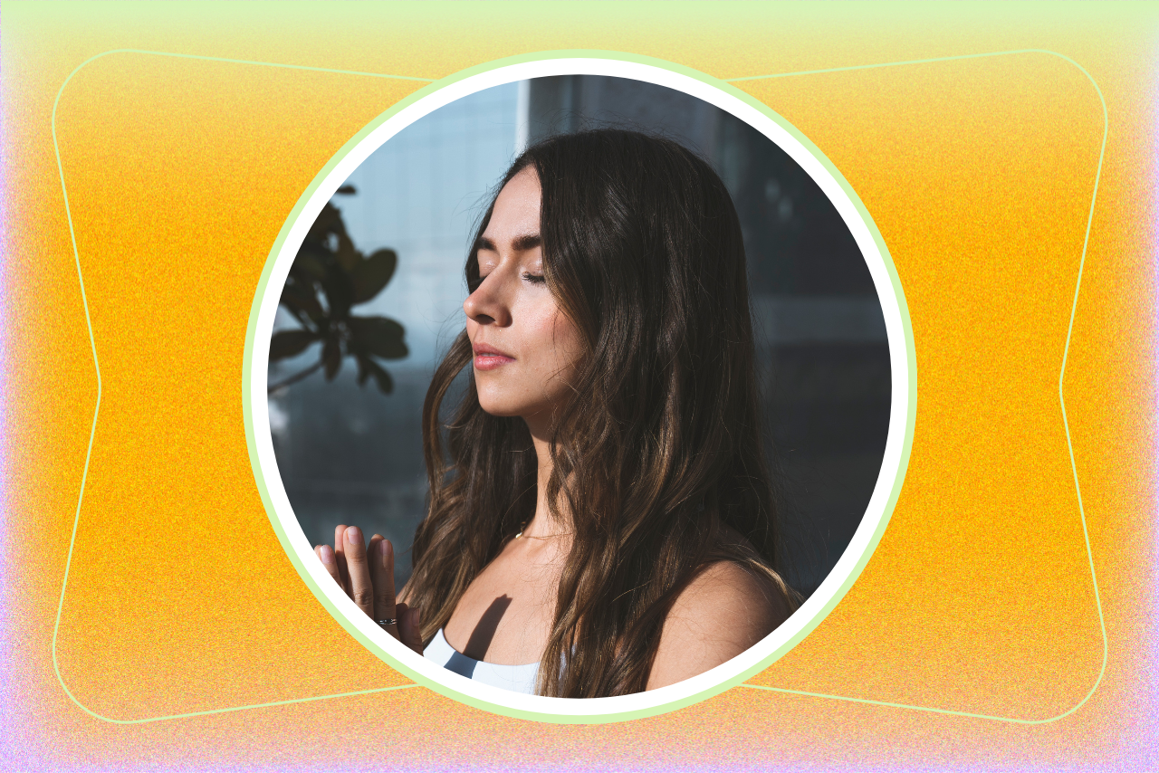 Woman meditating outside.